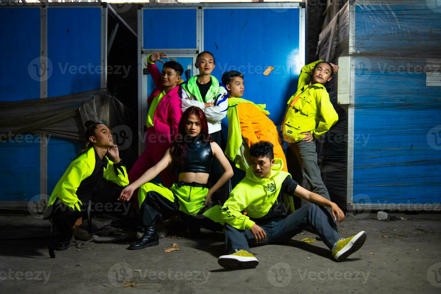 a group of Asian gay men posing sexy around a broken cupboard photo