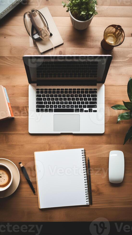 Neatly arranged workspace with a modern laptop and stationary, offering abundant copy space photo