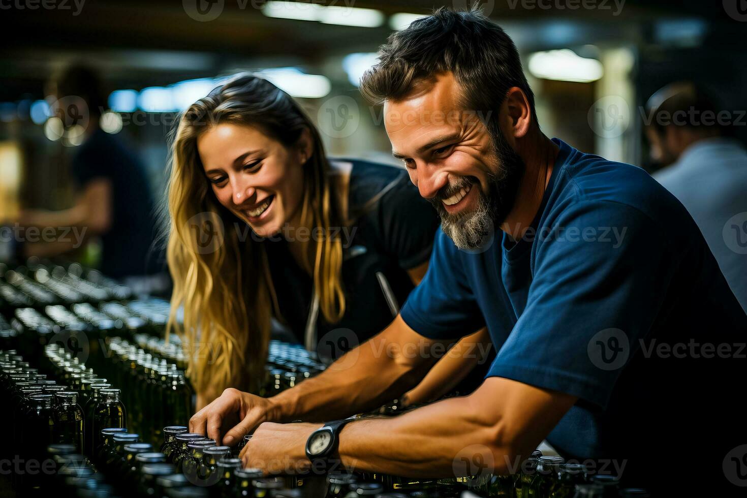 Artisanal workers carefully applying handmade labels on freshly bottled local olive oil photo