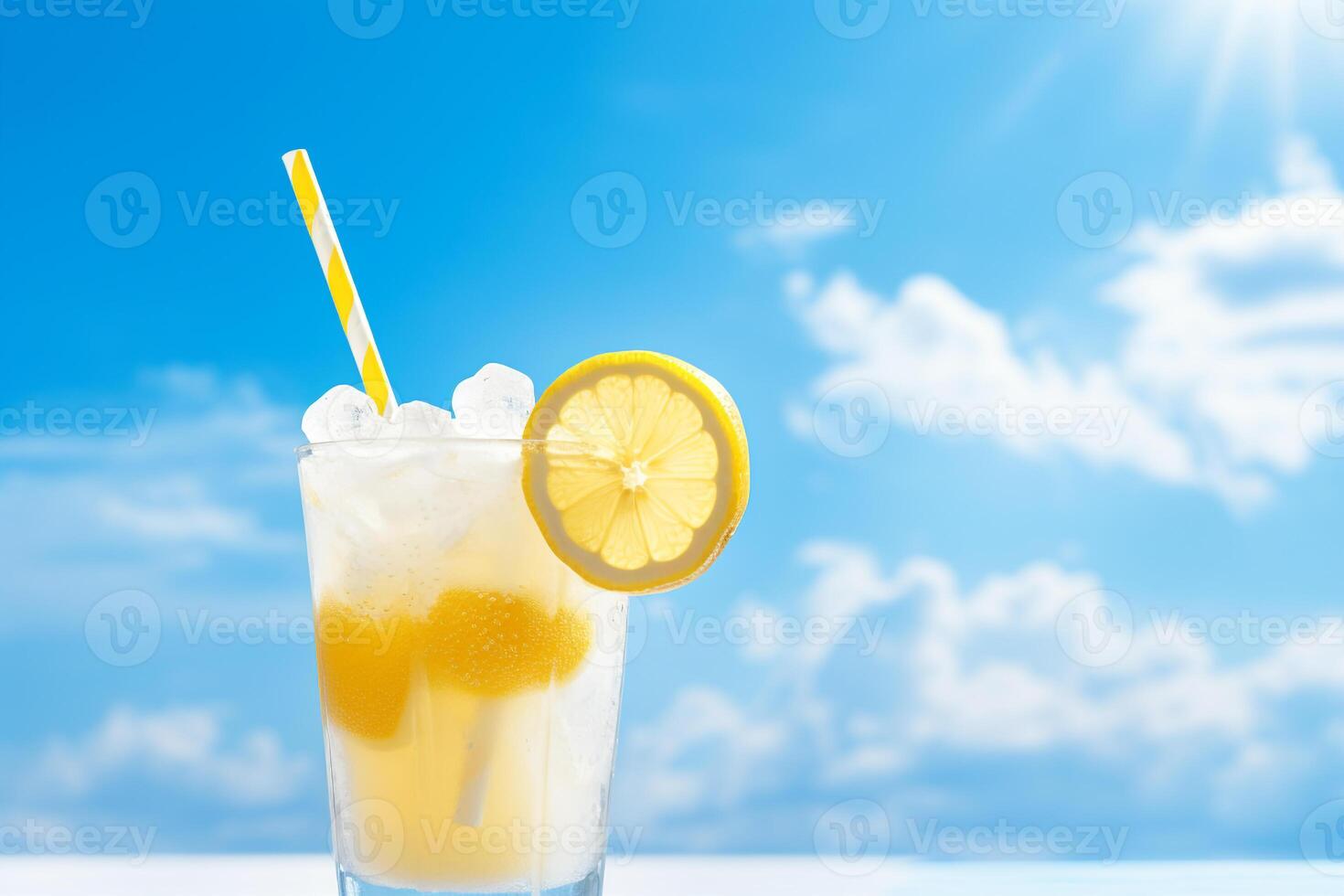 Bright Summer Image of Iced Lemonade in Glass with Lemon Slice and Straw photo