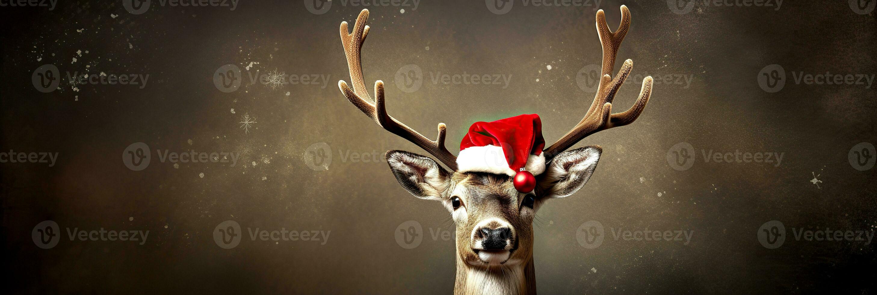 Christmas reindeer wearing santa claus hat on gray background photo