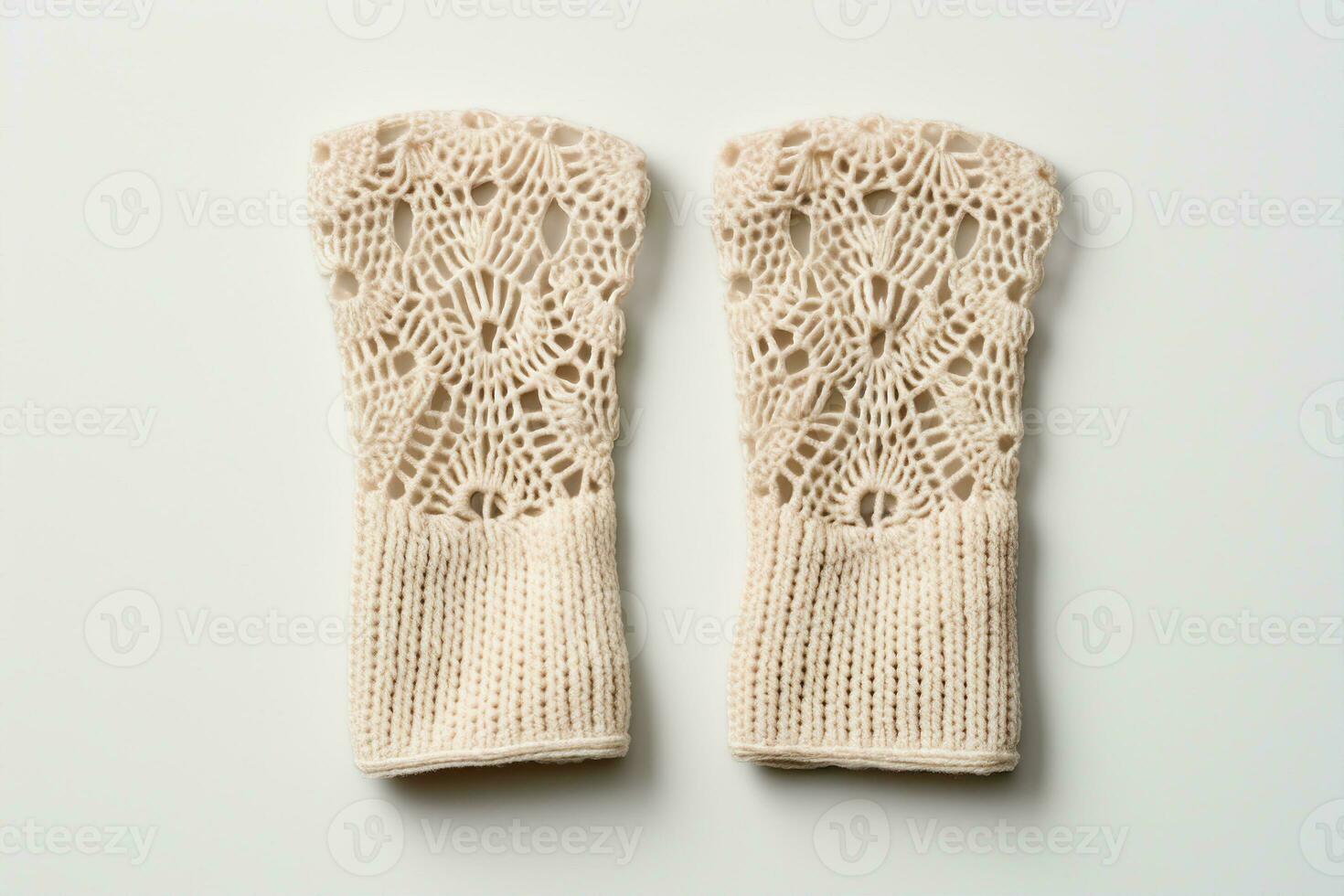 A pair of crocheted fingerless gloves, cream color, intricate texture, soft focus, minimalist flat lay. Softness, femininity, and elegance concept. AI Generated. photo