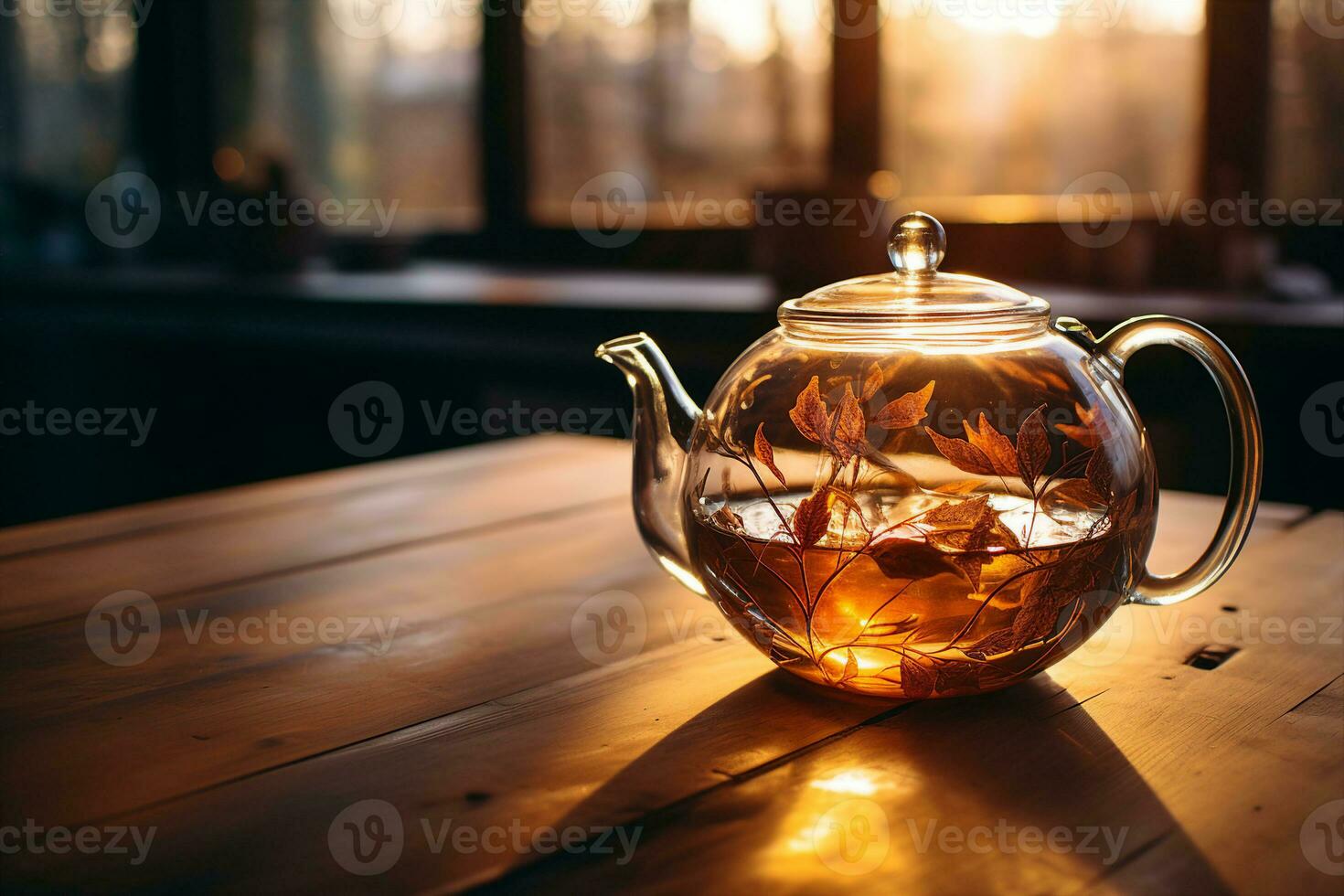 Dawn sunlight streams through a glass teapot with tea leaves, standing on a wooden table, illustrating a peaceful morning ritual. photo