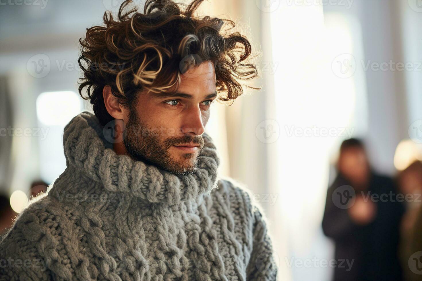 A profile view of a male model wearing a fuzzy oversized gray crochet sweater with intricate stitches. AI Generated. photo