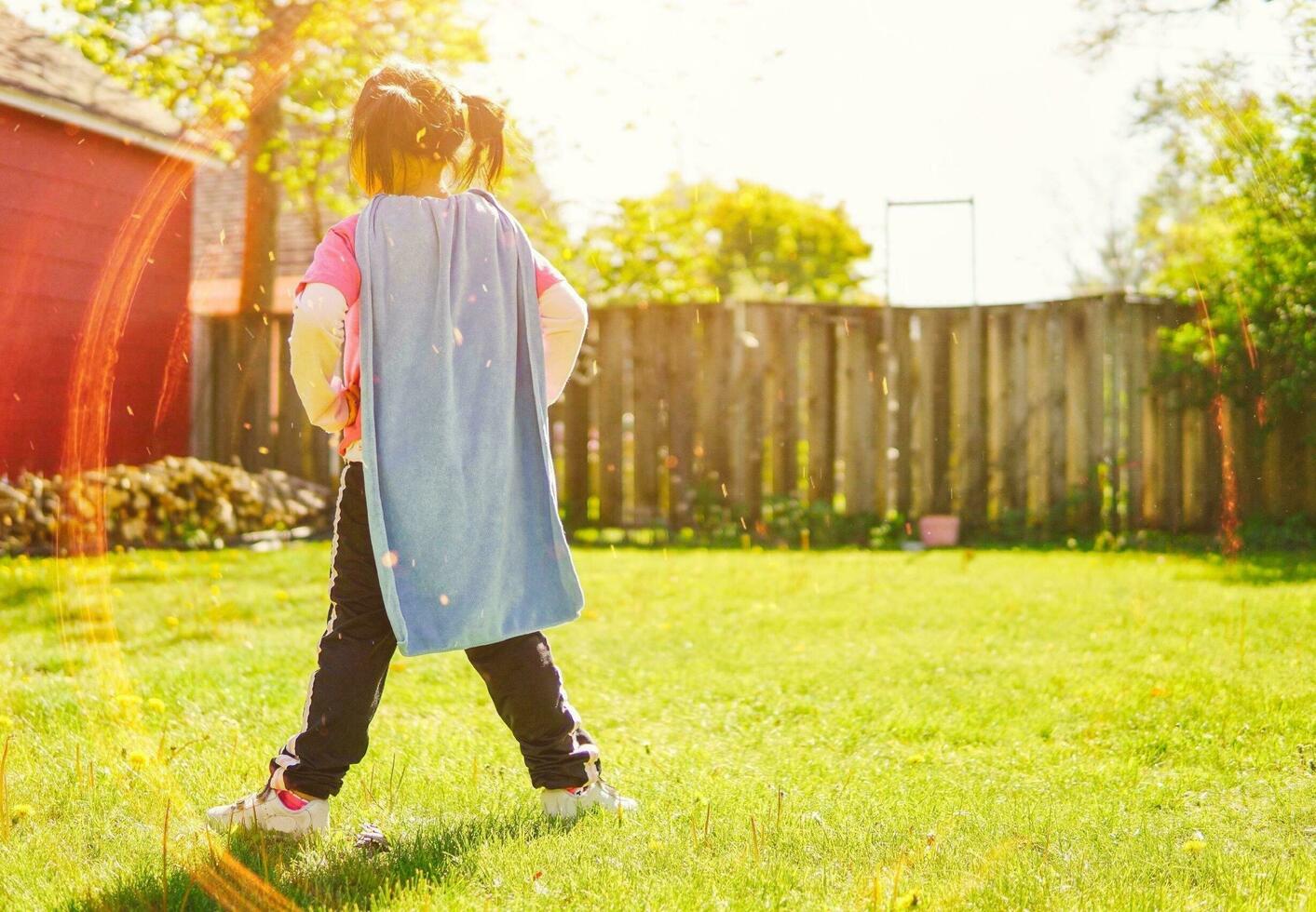 portrait of a girl. Happy little girl in autumn park. Fashion Kid outdoor. photo