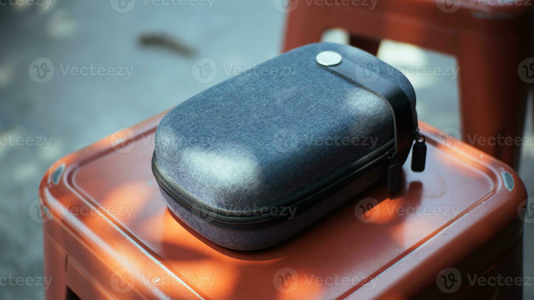 Close-up view of a mini travel pouch to accommodate electronic equipment. Can be used as a mockup. photo