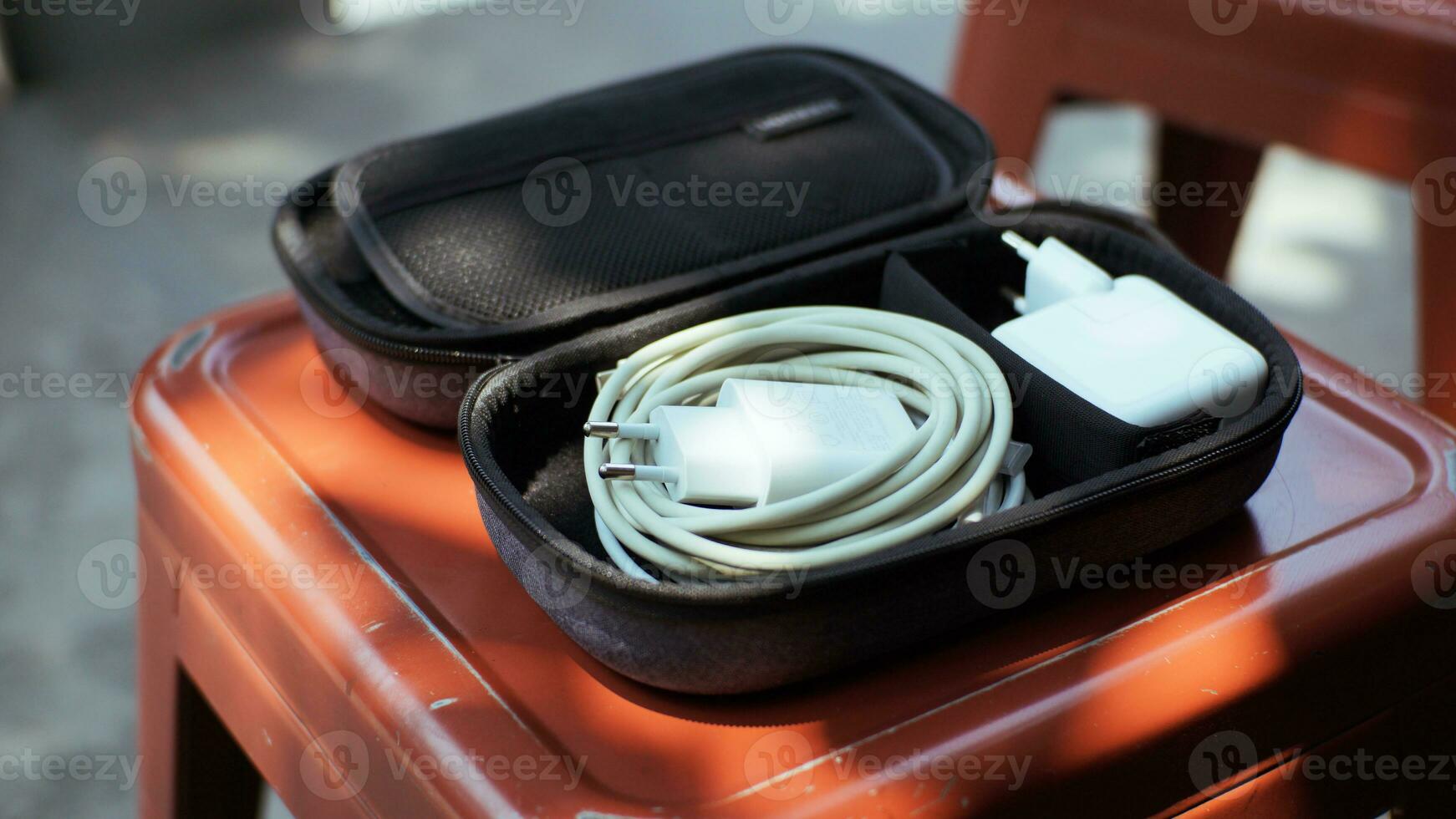 Modern bag for professional storage of cables, charging equipment or electronic equipment during trip or travel. photo