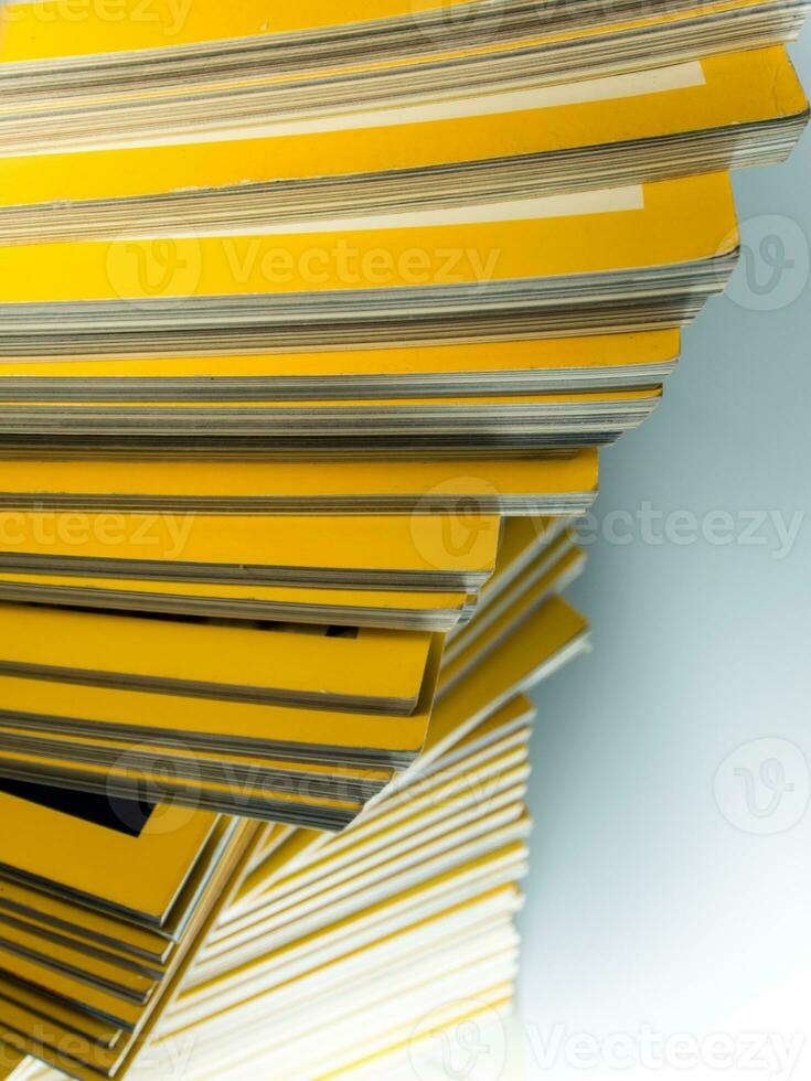 Stack of yellow monthly magazine photo