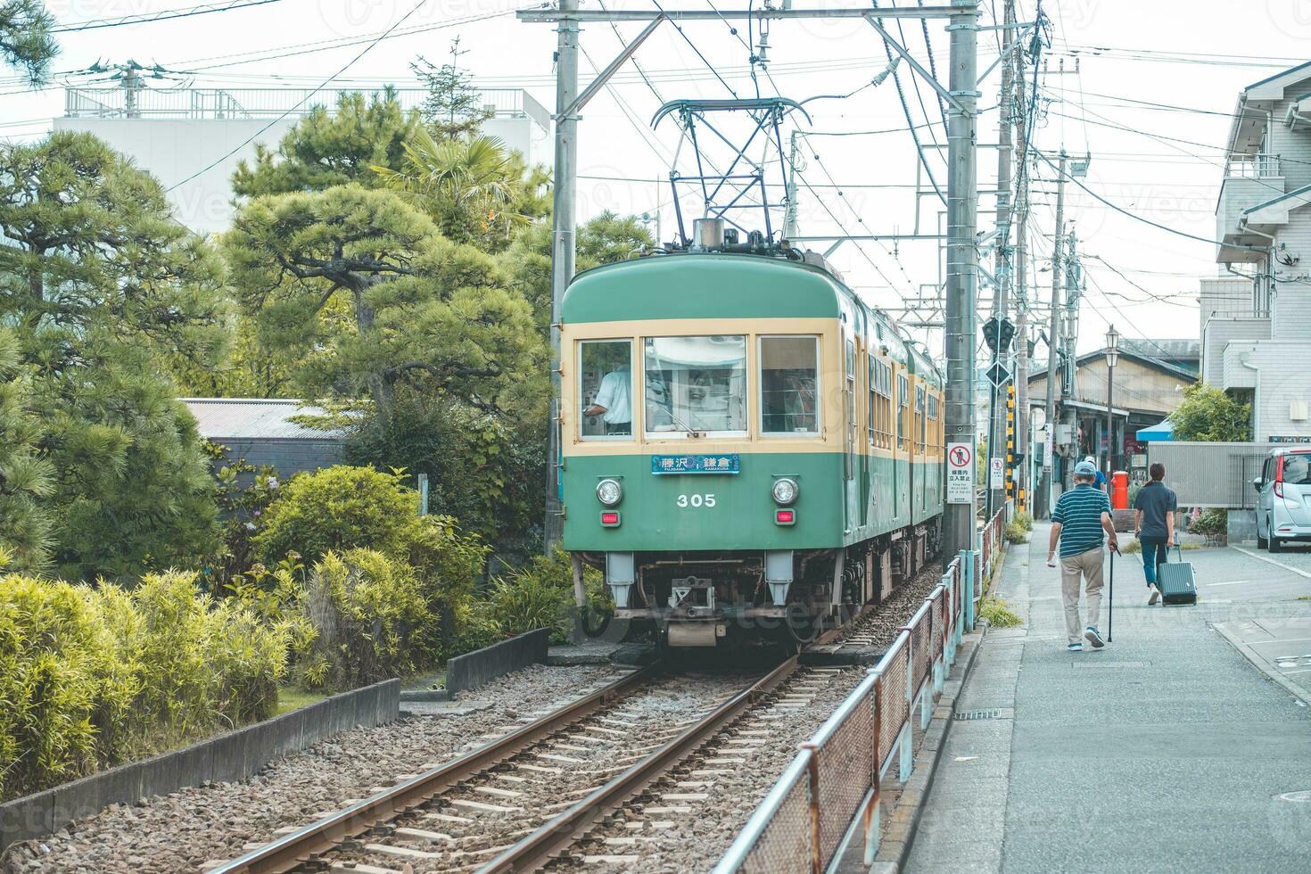 Enoshima tram or electric railway train at Fujisawa and Kamakura, Kanagawa, Japan photo