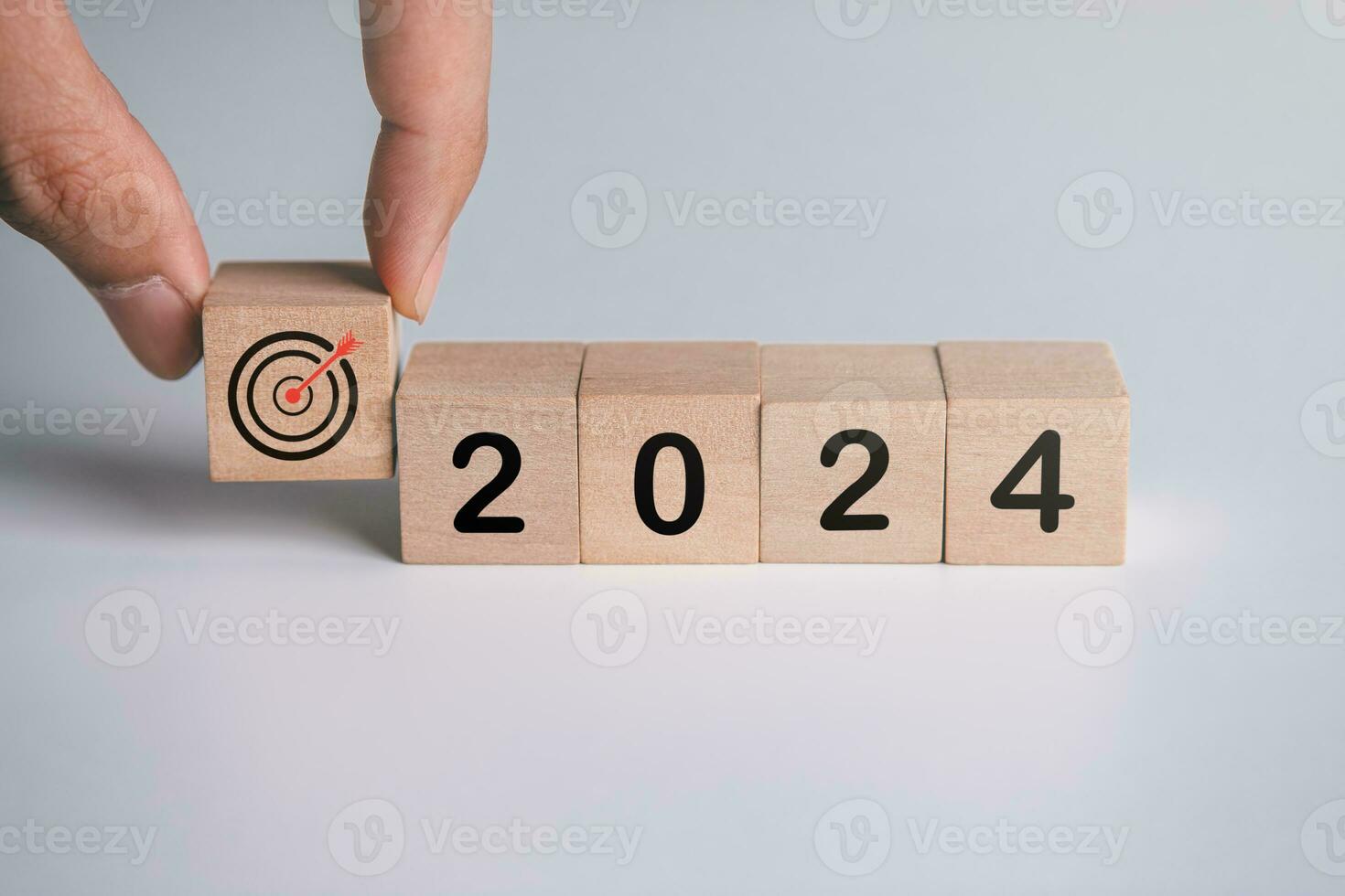 Wooden block with business goals in 2024. key performance indicator and business achievement goal concept. photo