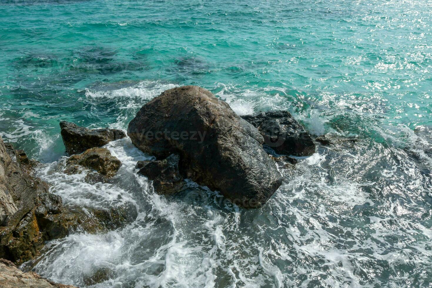 Beautiful scenic seascape blue ocean sea water on rock coast beach with splash wave on island, sky summer stone cliff coastal tide background for travel and tourism, high power turquoise pacific photo