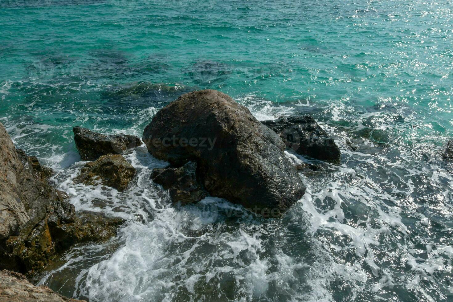 Beautiful scenic seascape blue ocean sea water on rock coast beach with splash wave on island, sky summer stone cliff coastal tide background for travel and tourism, high power turquoise pacific photo