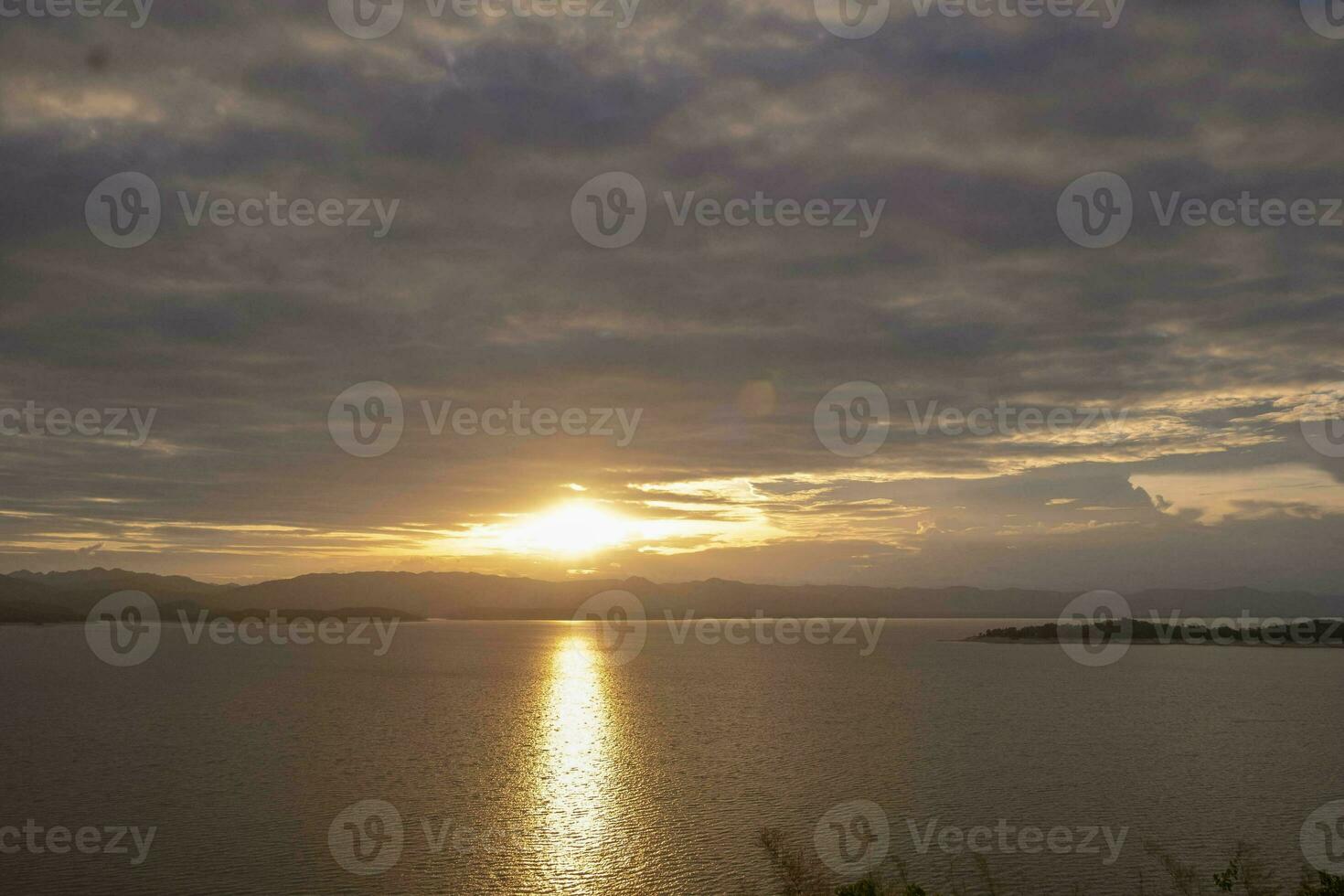 Travel for beautiful nature lake sunset, Relax vacation with landscape sky and evening sunlight, Calm outdoor holiday water reflection with cloud view background, peaceful calm horizon mountain photo