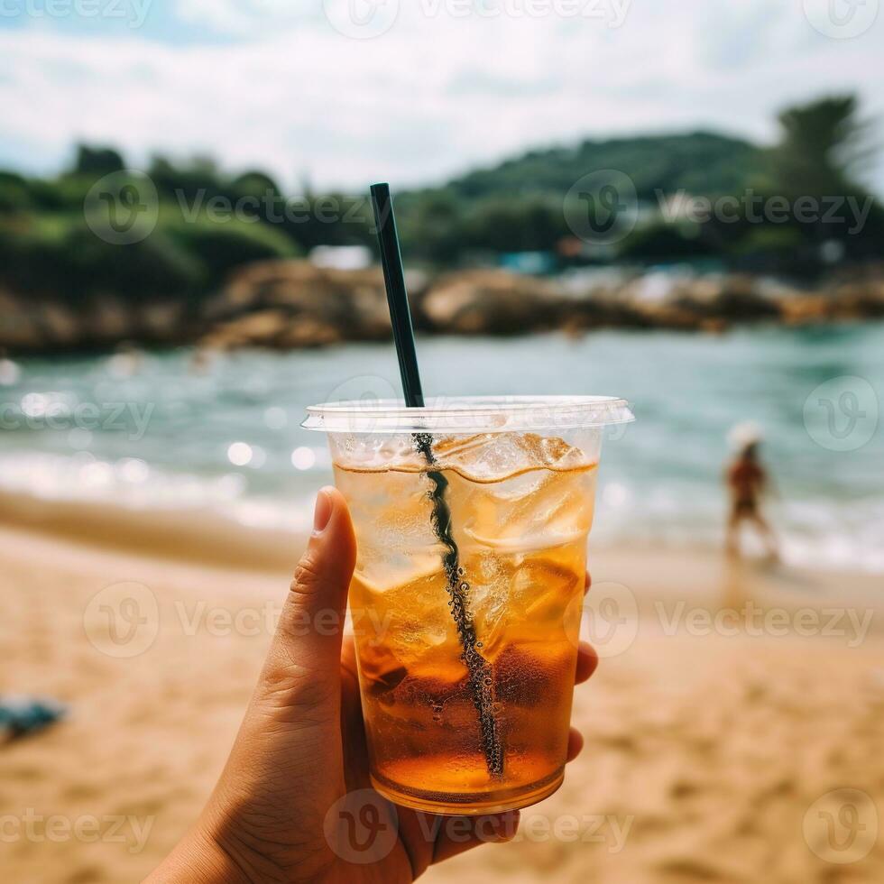 AI Generative a person holding a drink in front of a beach photo