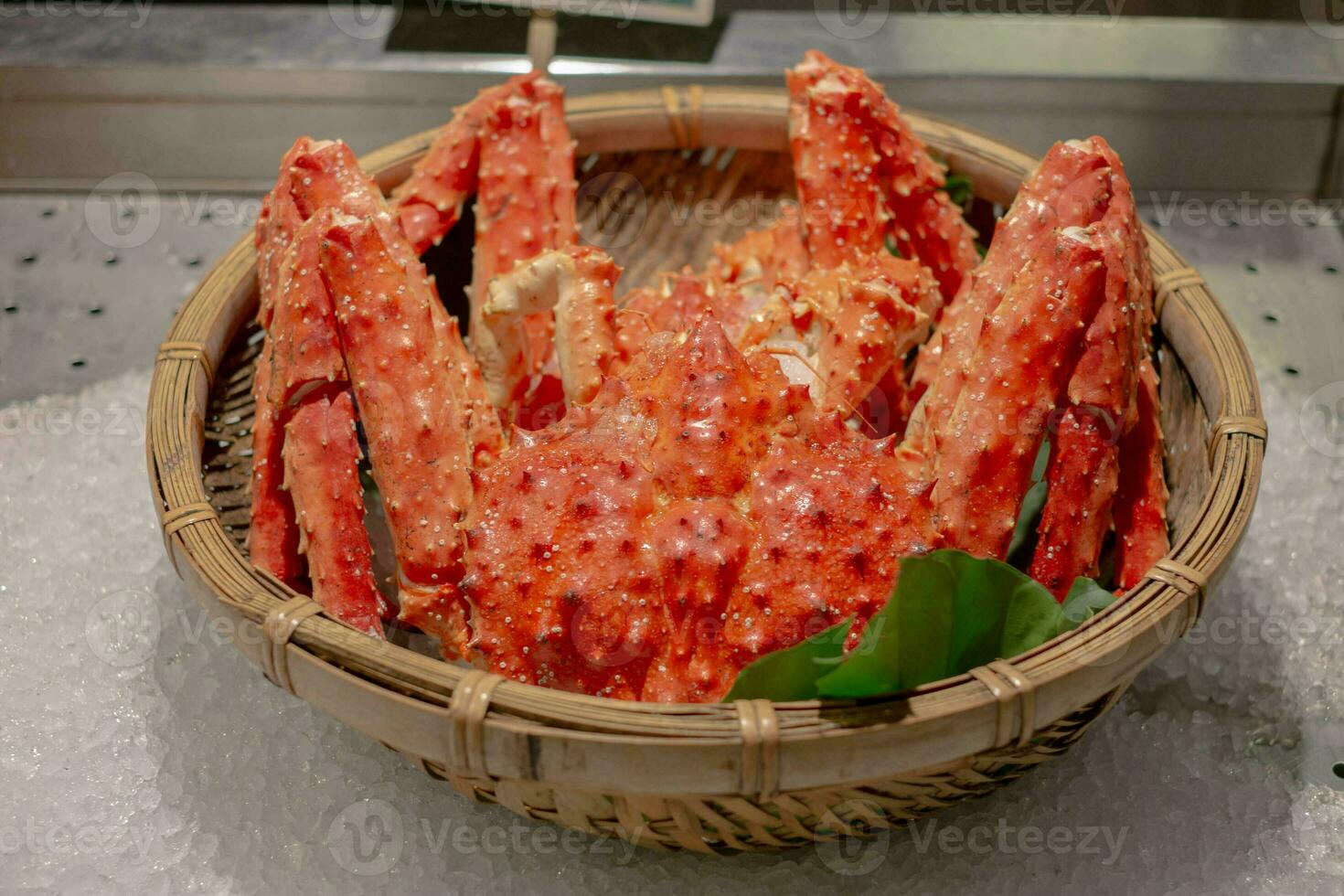 Red fresh steamed boil king crab leg from sea for delicious tasty seafood meal in store market restaurant, orange alaskan claw raw luxury crustacean animal for healthy gourmet in Japanese Asia pacific photo