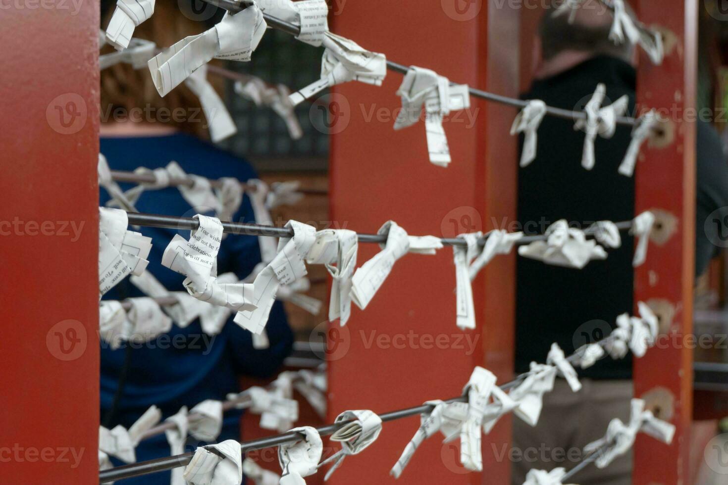 White paper tie knot in Tokyo and Kyoto Japan shrine temple tourism wish and pray for luck, symbol of faith and fortune spiritual Asia Buddhism culture tradition hope for good chance future destiny photo