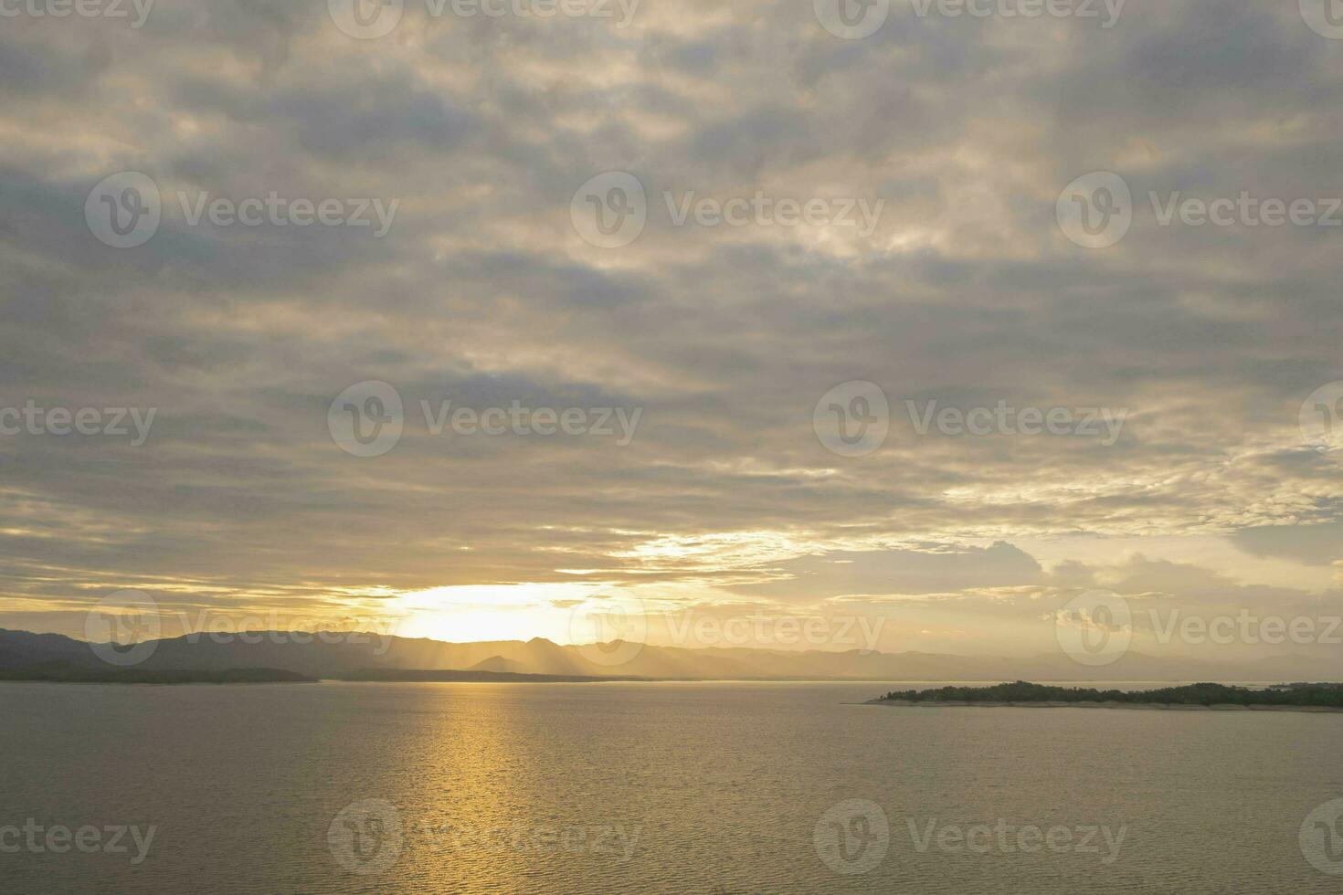 Travel for beautiful nature lake sunset, Relax vacation with landscape sky and evening sunlight, Calm outdoor holiday water reflection with cloud view background, peaceful calm horizon mountain photo