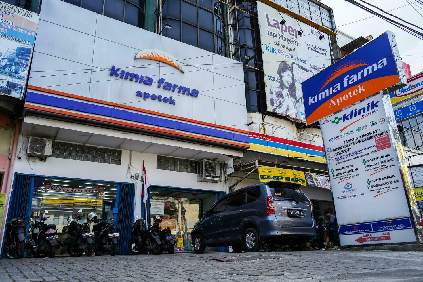 Indonesia, Jakarta, August 12, 2023, kimia farma apotek pharmacy company logo neon box sign signege facade photo