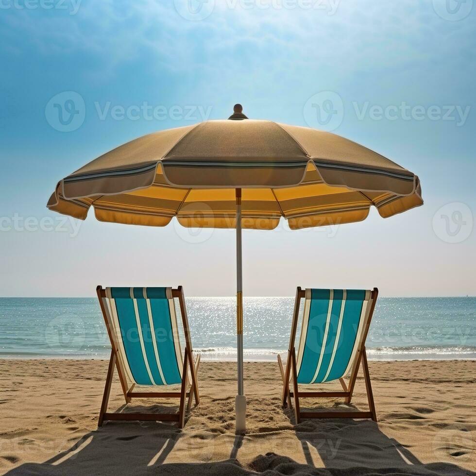 two lawn chairs under an umbrella on a beach photo