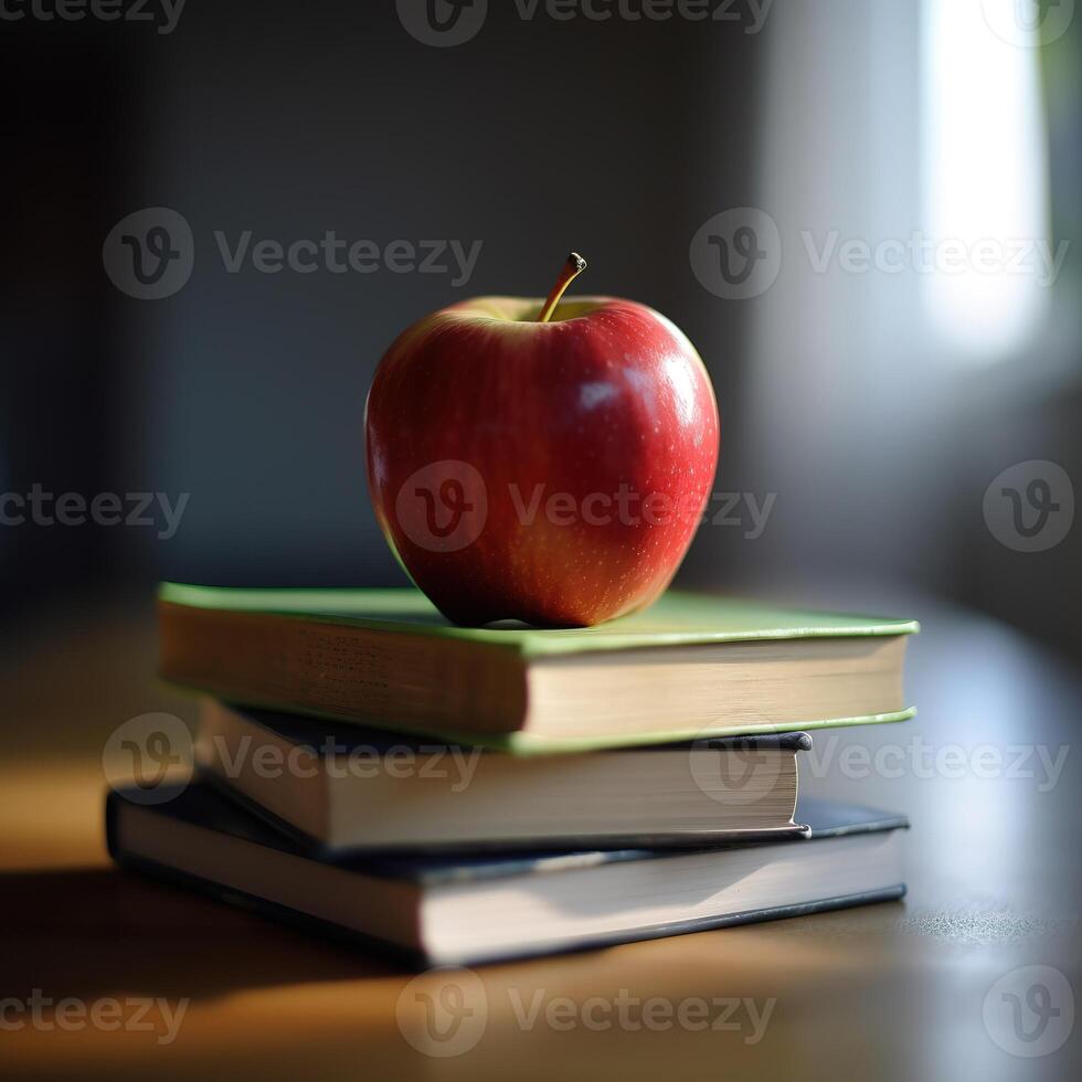 a stack of books with an apple on top of them photo