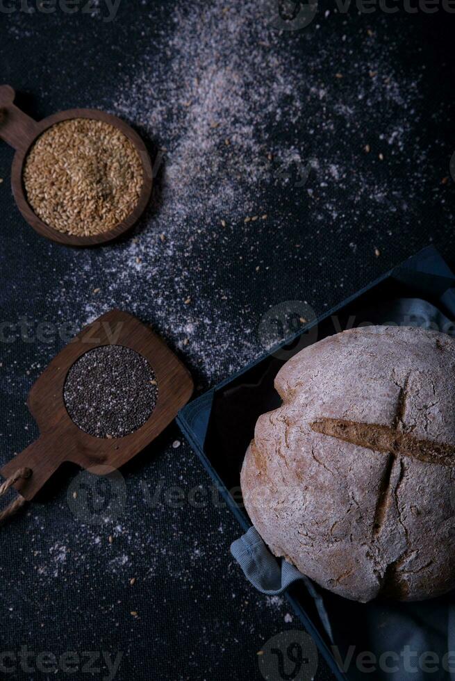 Freshly prepared and cut bread served at the table with seeds. photo