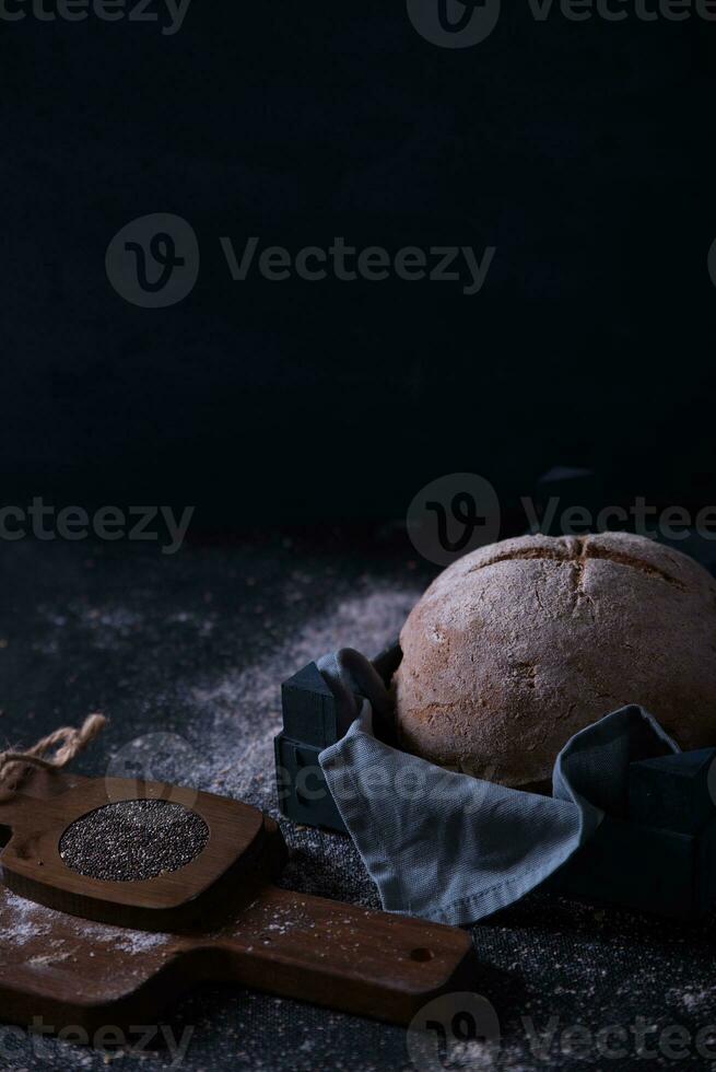 Freshly prepared and cut bread served at the table with seeds. photo