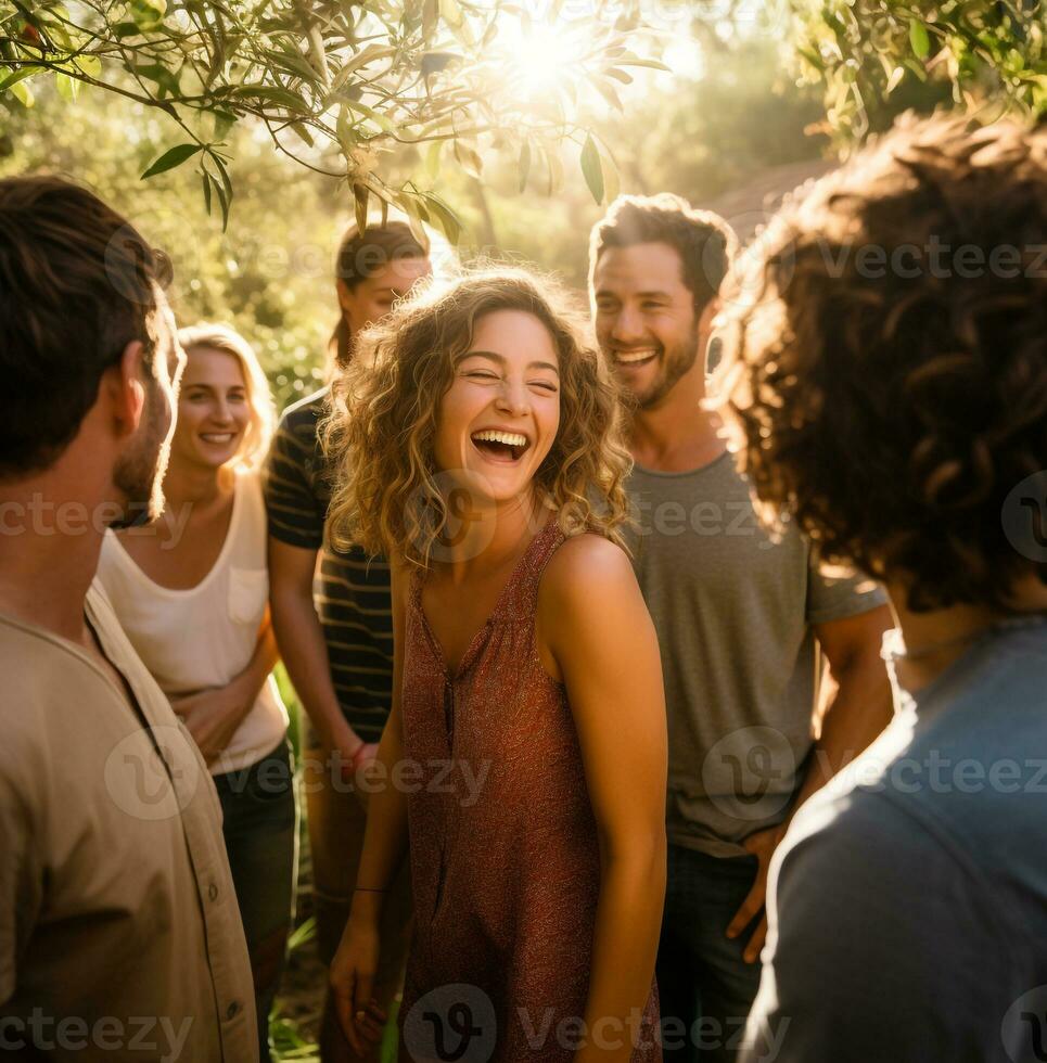 The girl is standing in the center of the frame surrounded by her family and friends, nature stock photo