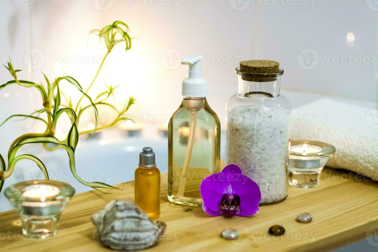 Spa-beauty salon, wellness center. Spa treatment aromatherapy for a woman's body in the bathroom with candles, oils and salt. photo