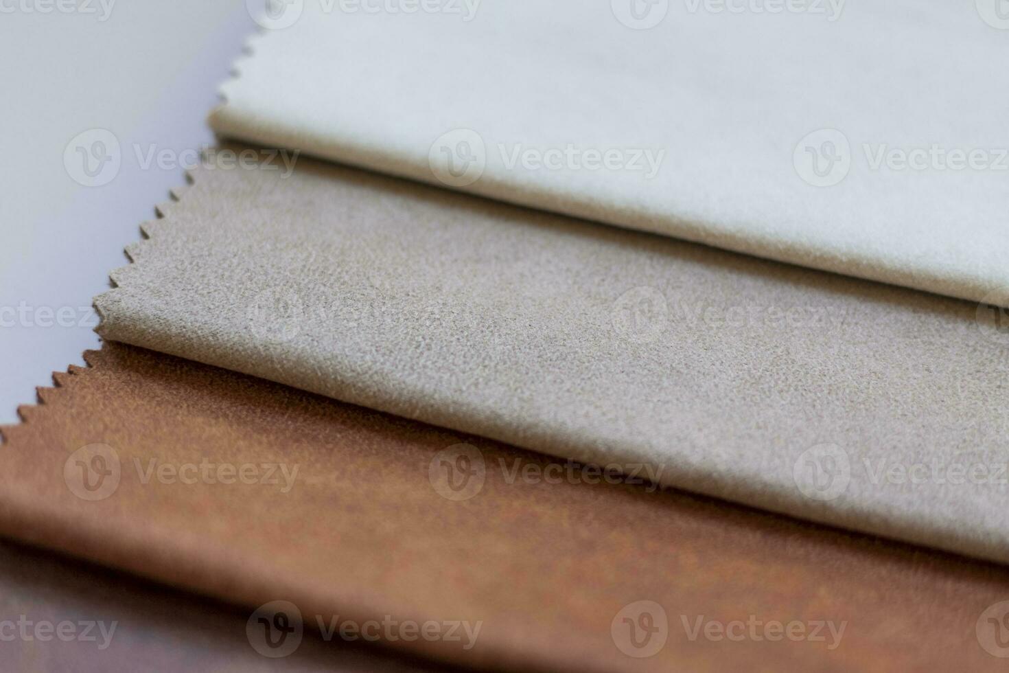 Backgrounds made of natural and artificial fabrics for the decoration of textiles, furniture and clothing on a beige background. Furniture production. wallpaper with space for copying text. photo