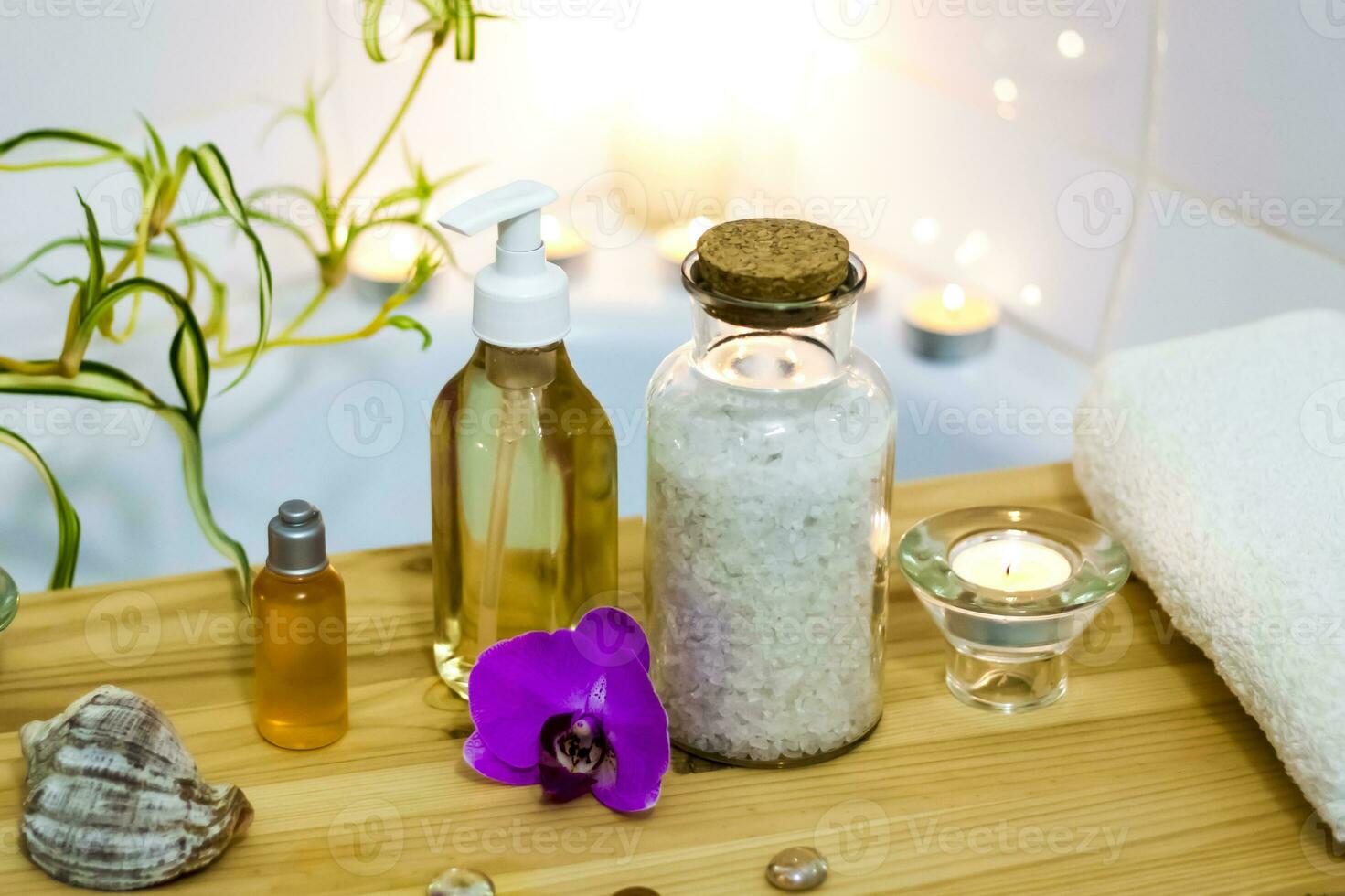 Spa-beauty salon, wellness center. Spa treatment aromatherapy for a woman's body in the bathroom with candles, oils and salt. photo