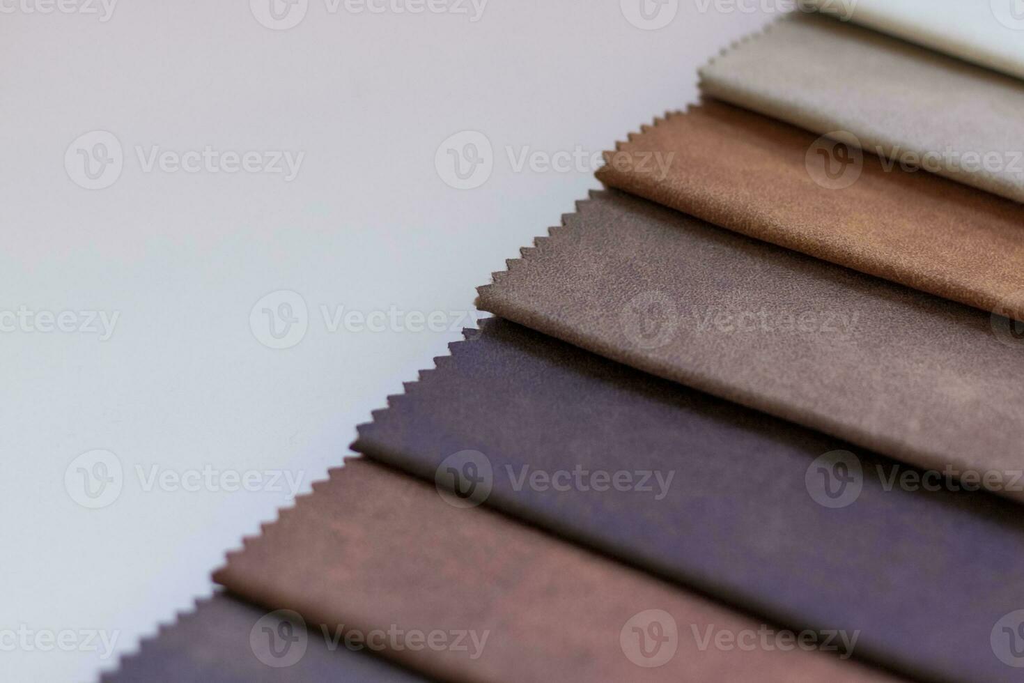 Backgrounds made of natural and artificial fabrics for the decoration of textiles, furniture and clothing on a beige background. Furniture production. wallpaper with space for copying text. photo