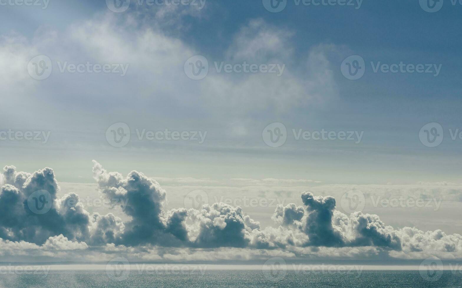 Background of puffy clouds and blue sky photo