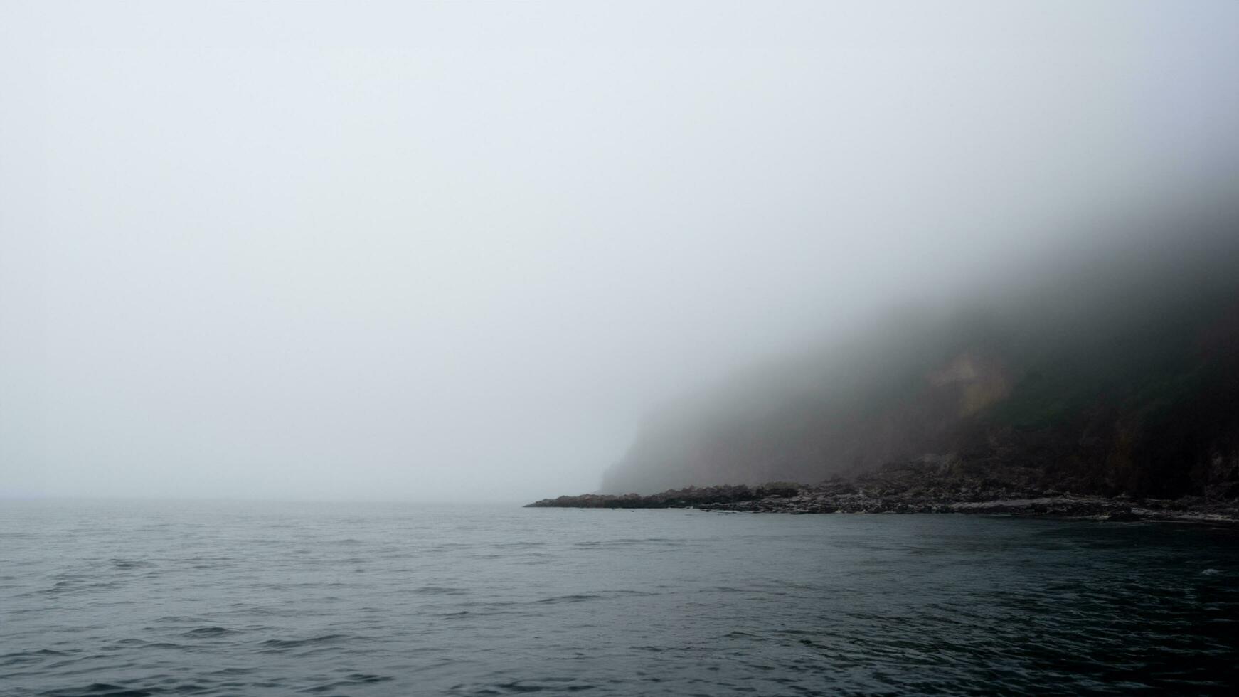 The sea hills and sand are covered with fog and spray scary mystery ocean and mountains Tourist attraction 3d illustration photo