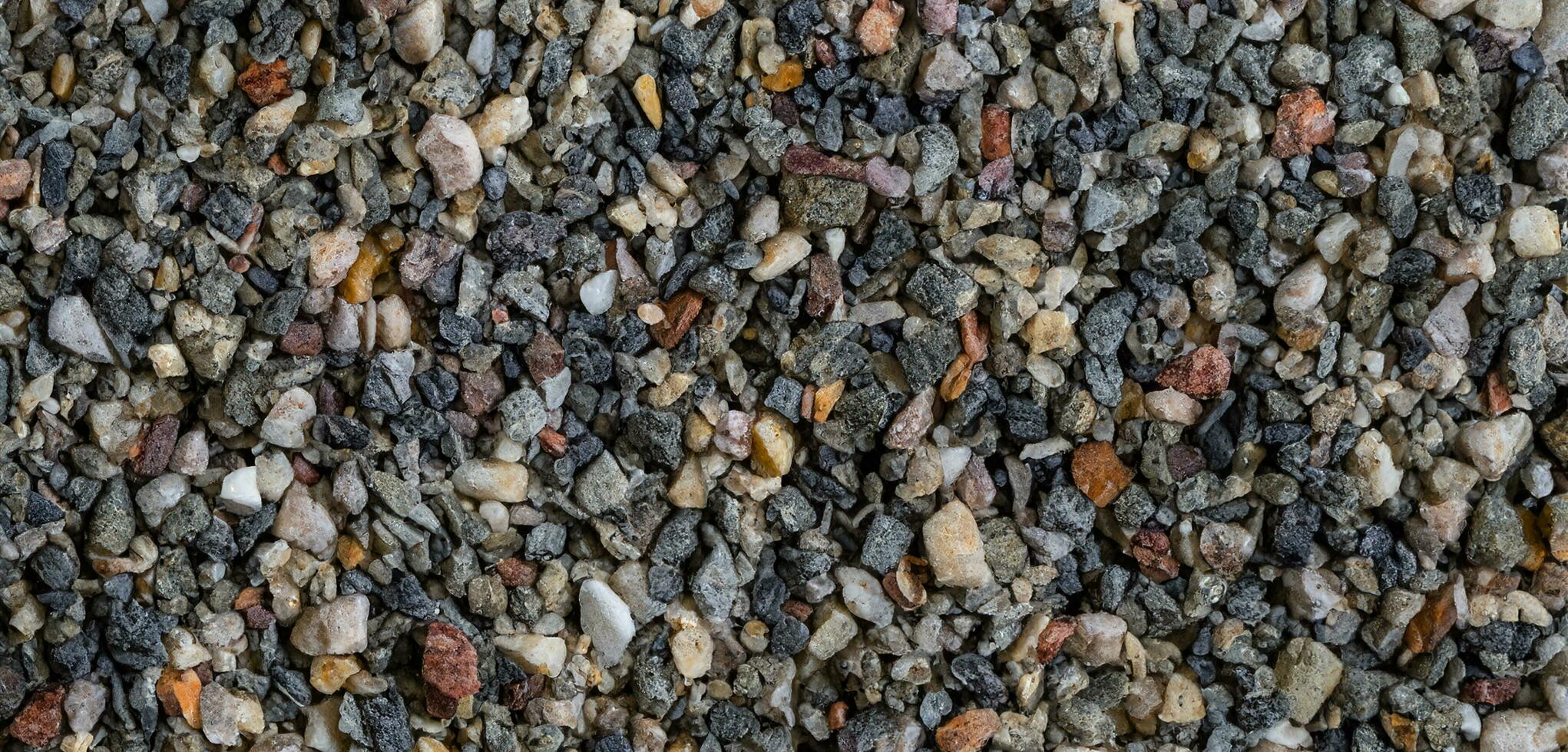 Pebbles background  Wet Stones Beach pebbles Abstract background with small multi colored stones For design the pattern is natural Pebble stone 3D illustration photo