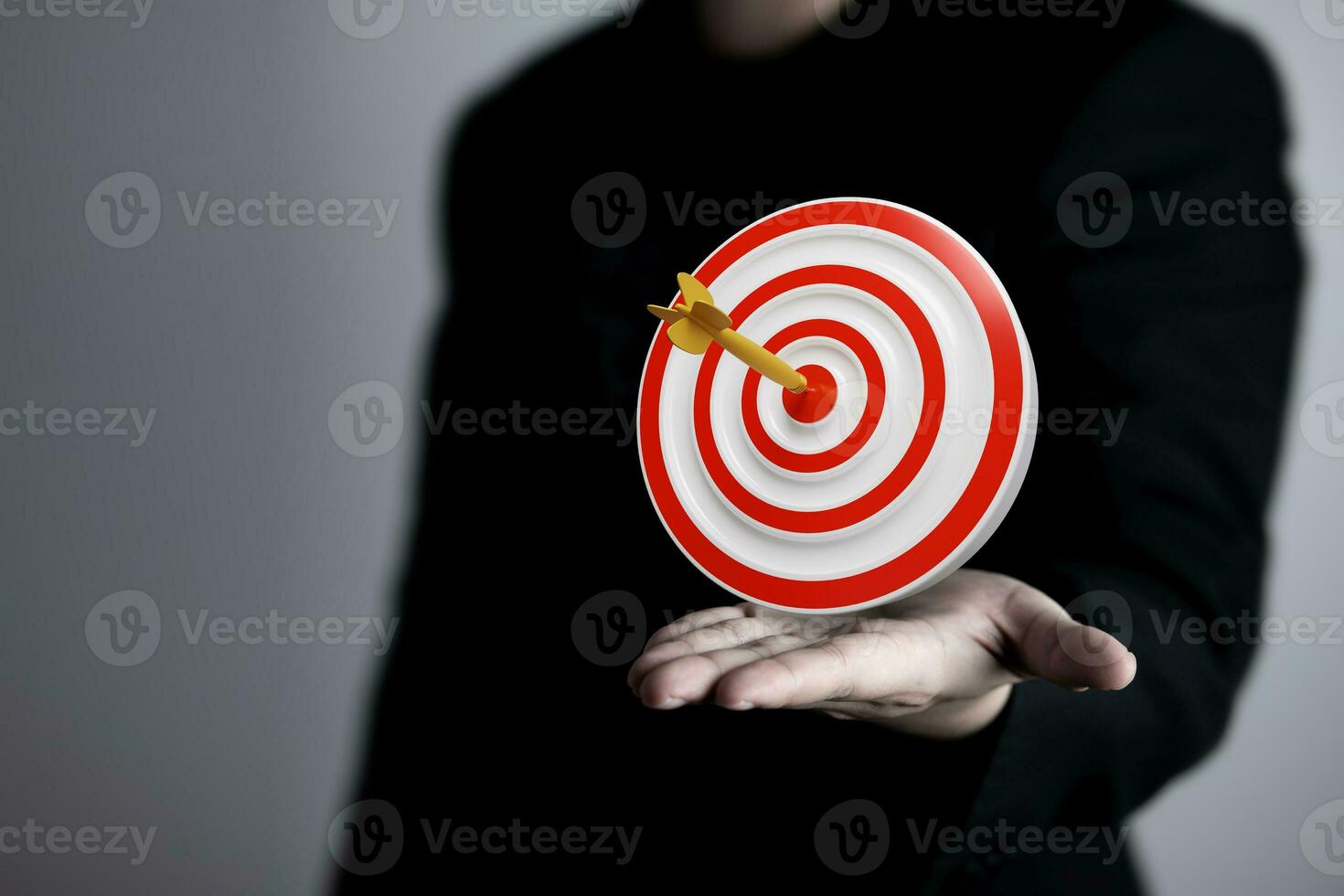 Businessman showing virtual target board on hand. Success concept, planning and setting goals objectives for business investment photo
