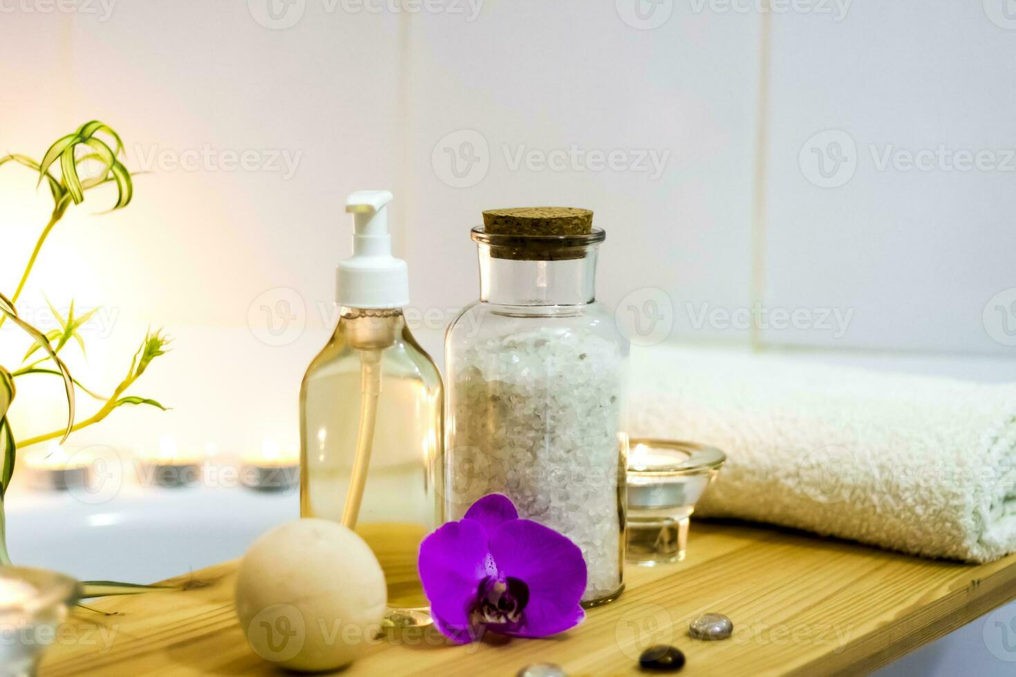 Spa-beauty salon, wellness center. Spa treatment aromatherapy for a woman's body in the bathroom with candles, oils and salt. photo