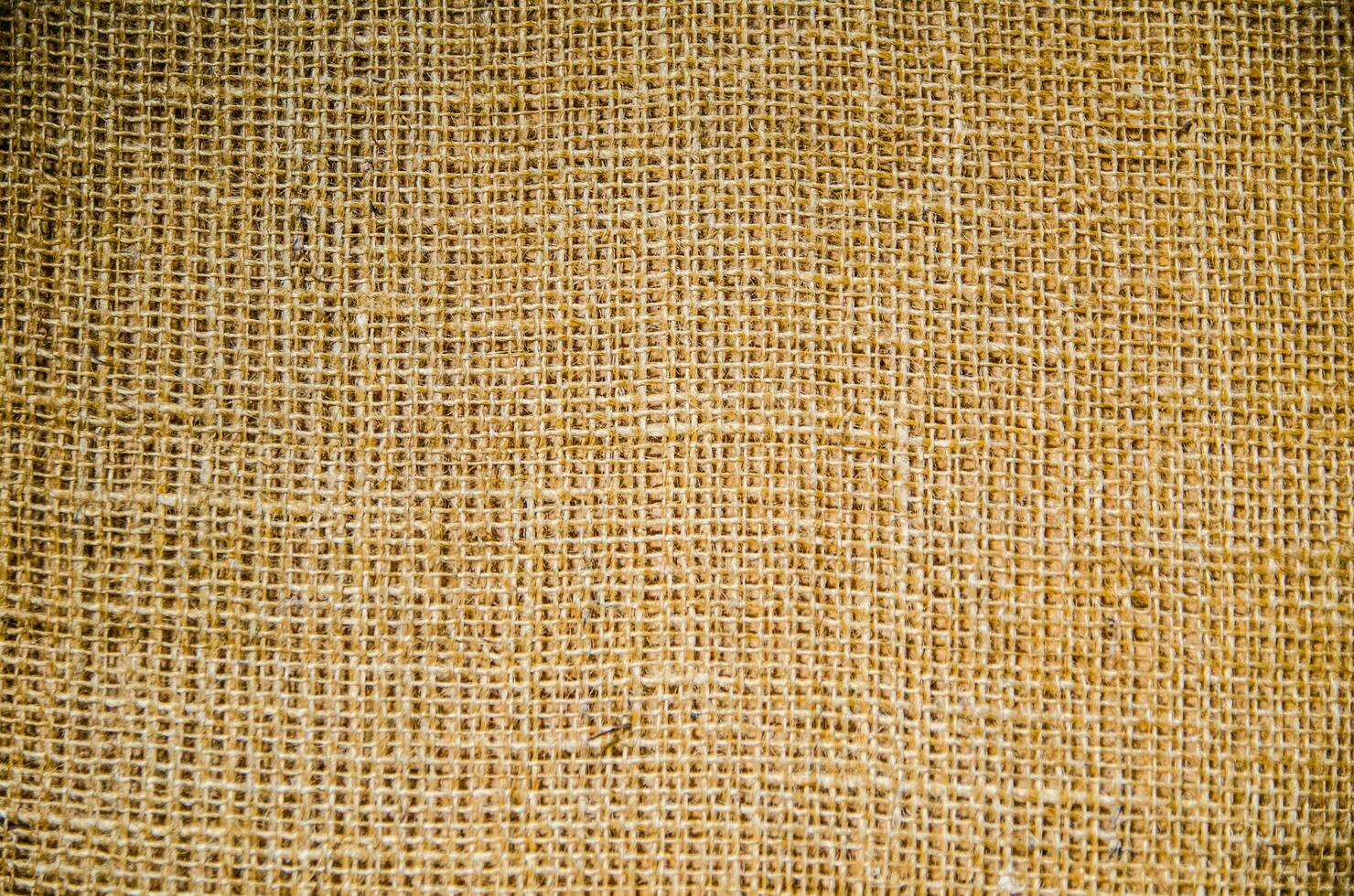 Brown texture of sack in close up, made of strong cloth. photo