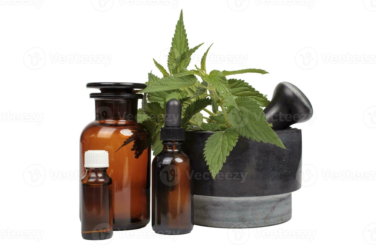 Natural Medicine Mortar with Nettle and Medical Bottles photo