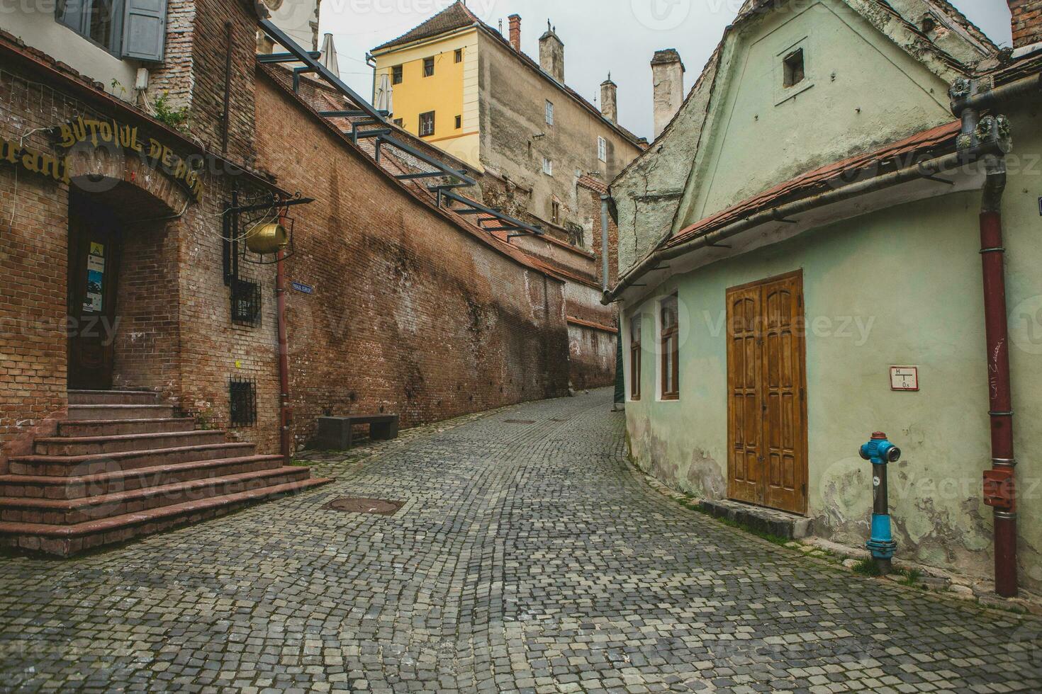 Medieval street with historical buildings in the heart of Romania. Sibiu the eastern European citadel city. Travel in Europe photo