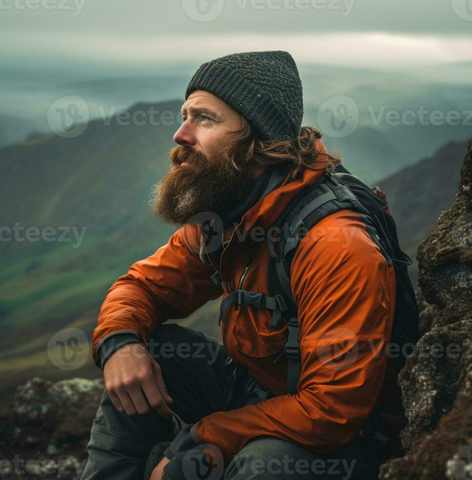 A mountain man looks out over a valley stock video, wanderlust travel stock images, travel stock photos wanderlust