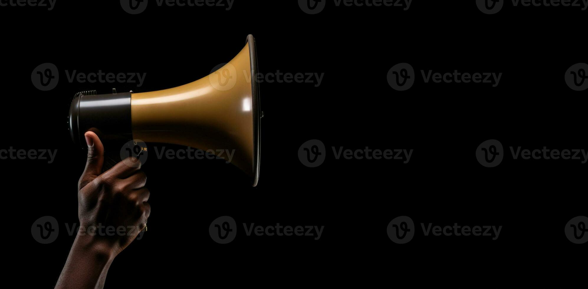 Generative AI, golden megaphone in hand on a empty black background, panoramic image with copy space photo