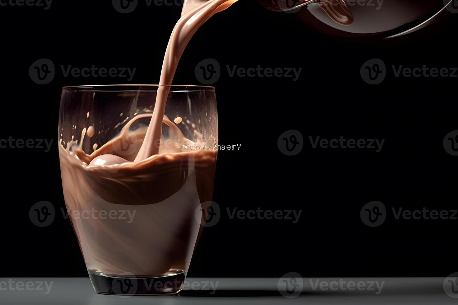 Pouring chocolate milk into a glass, isolated on black background photo