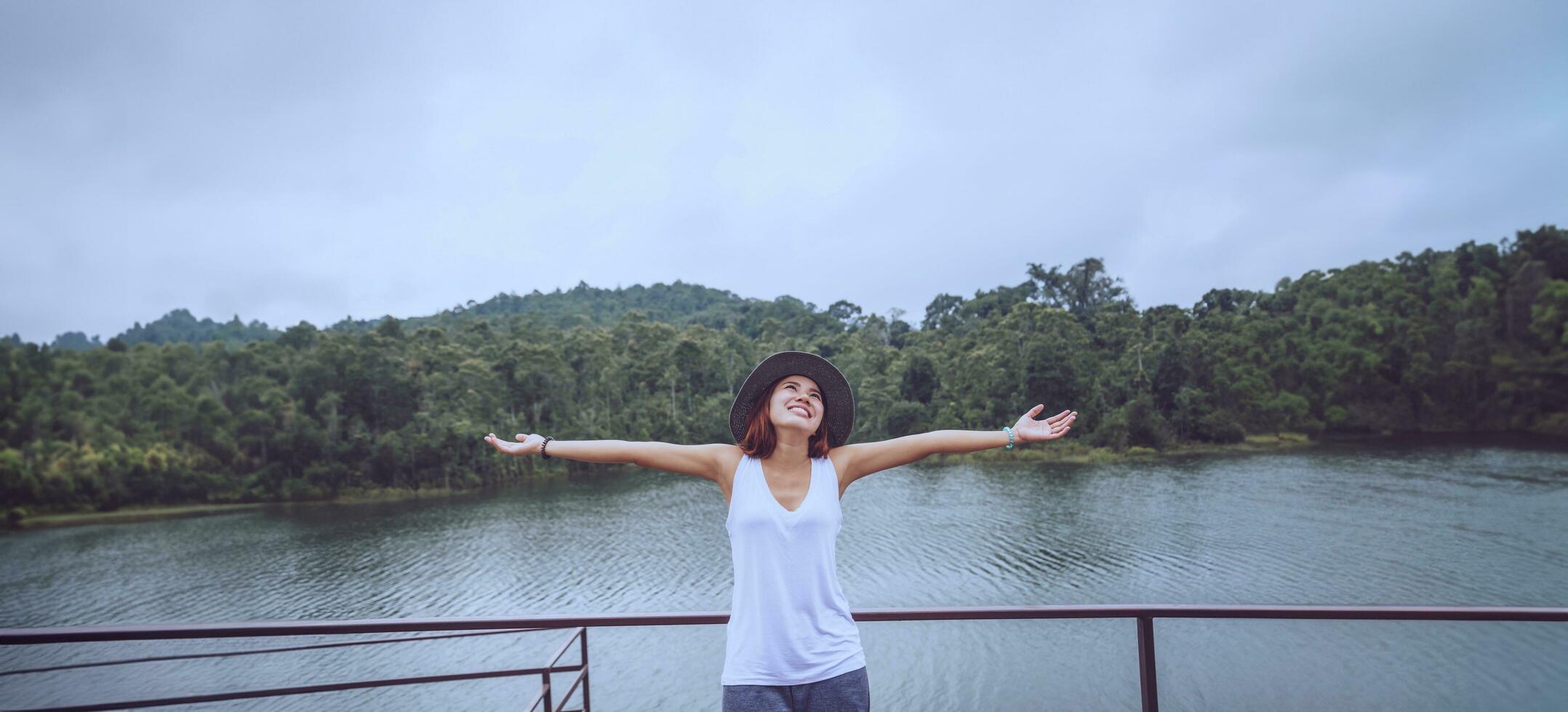 Asian women relax in the holiday. In the natural atmosphere, mountain forest. photo