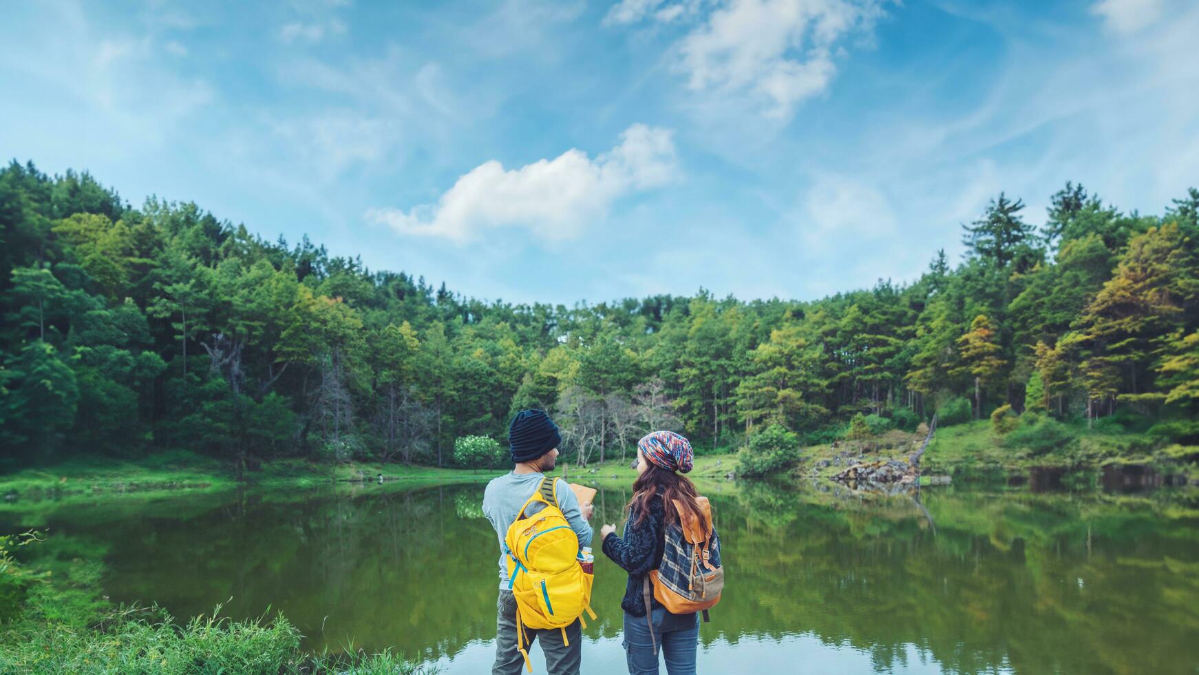 Lovers travel to watch the cherry trees of Asian couples. Happy with honeymoon travel,valentines. photo