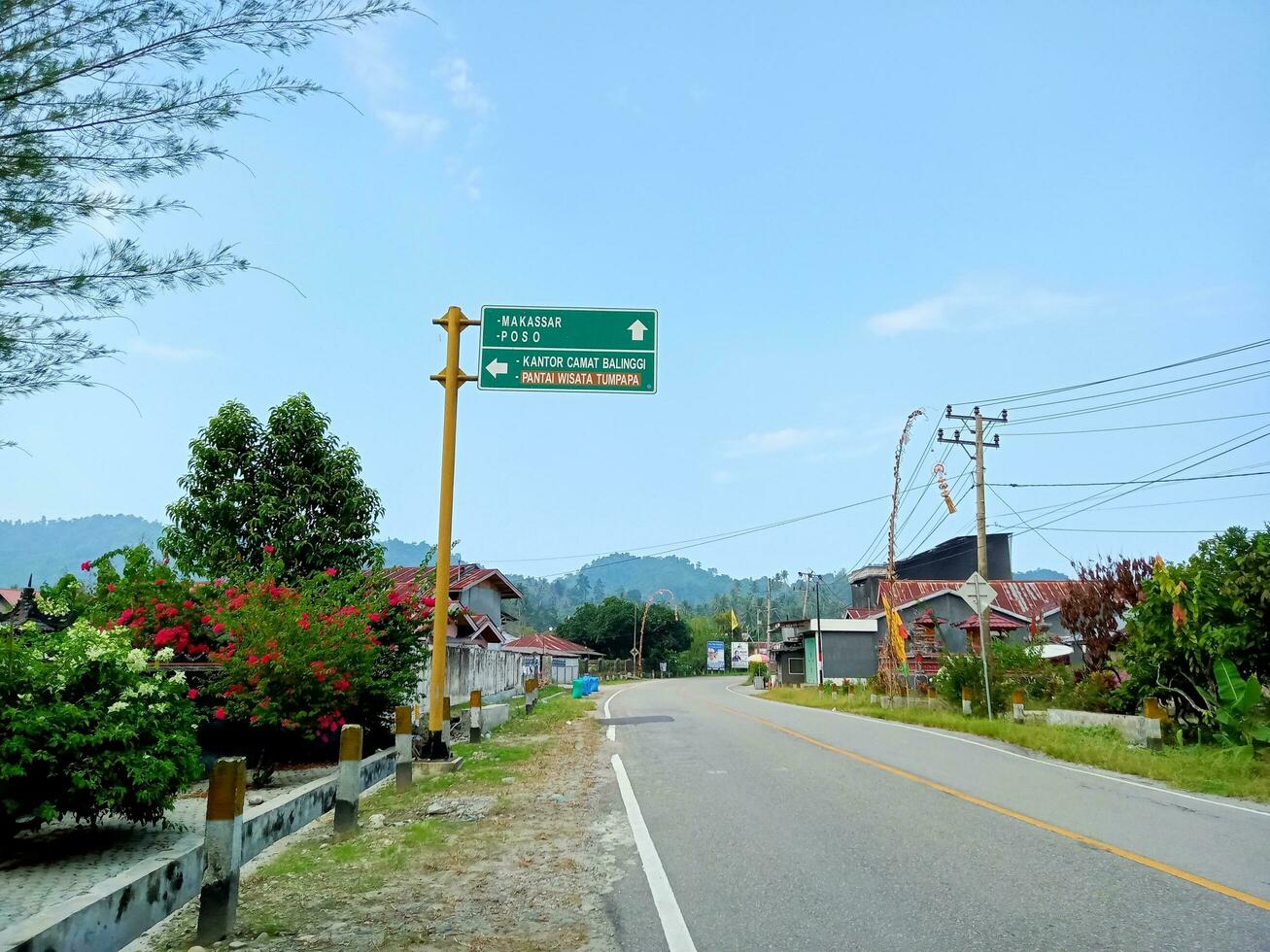 Parigi Moutong, Central Sulawesi, Indonesia - 28 August 2023 - The atmosphere looks quiet on the Trans Sulawesi road, Balinggi District, Parigi Moutong Regency, Central Sulawesi in the afternoon photo