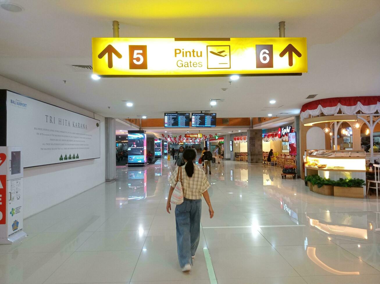 Kuta, Badung, Bali, Indonesia - August 25 2023 - View of the hallway leading to the aircraft departure gate at I Gusti Ngurah Rai International Airport in the morning photo