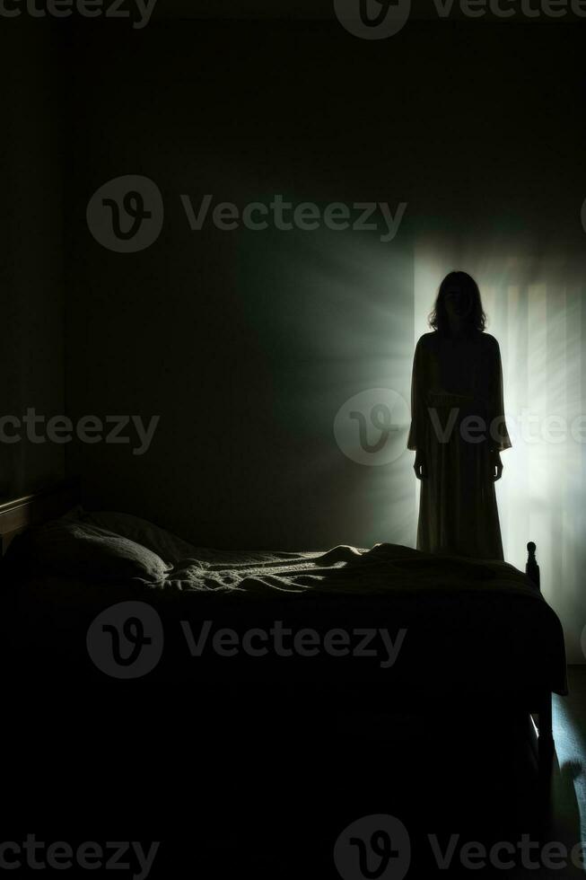 Shadowy figure looming over sleeping figure background with empty space for text photo