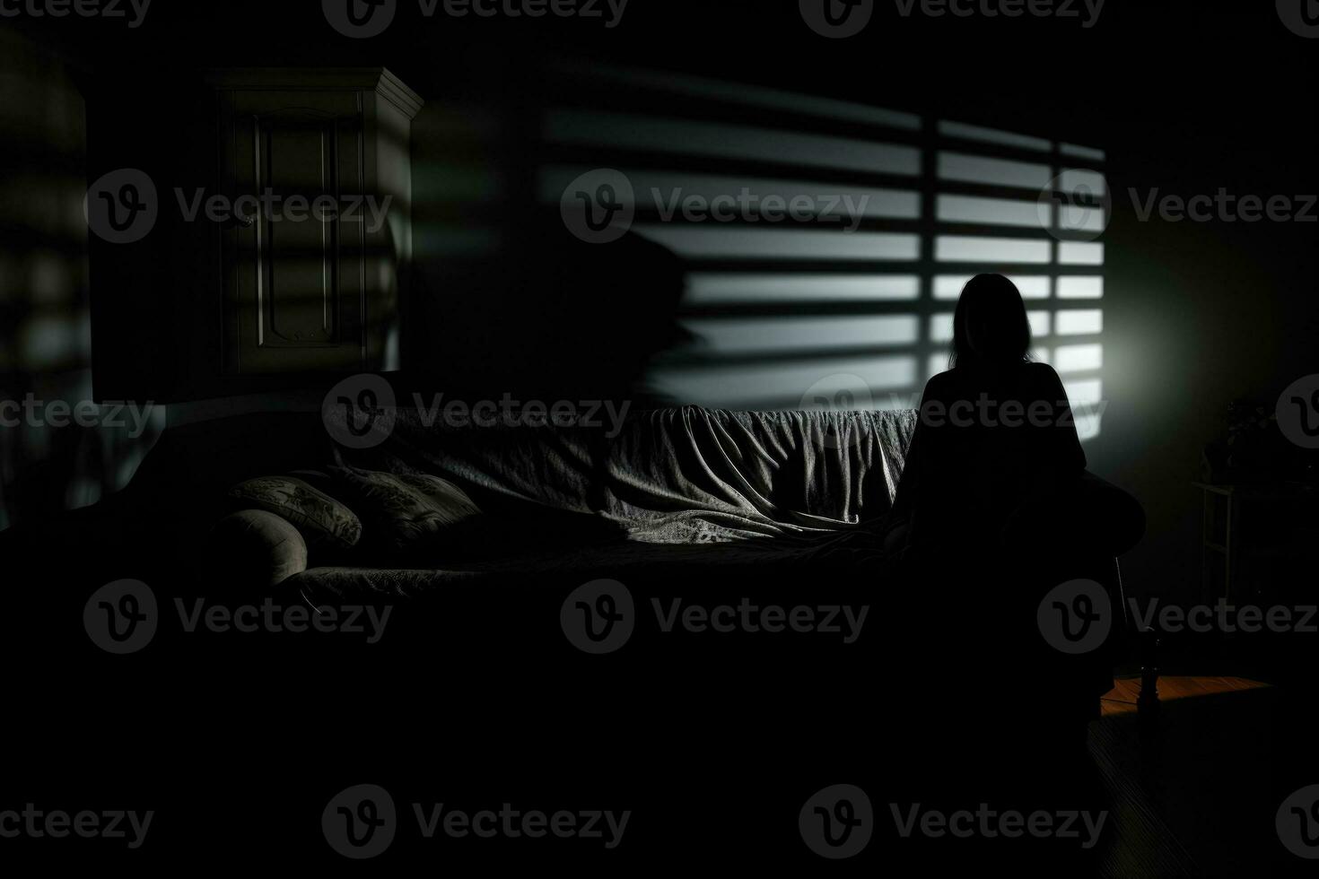 Shadowy figure looming over sleeping figure background with empty space for text photo