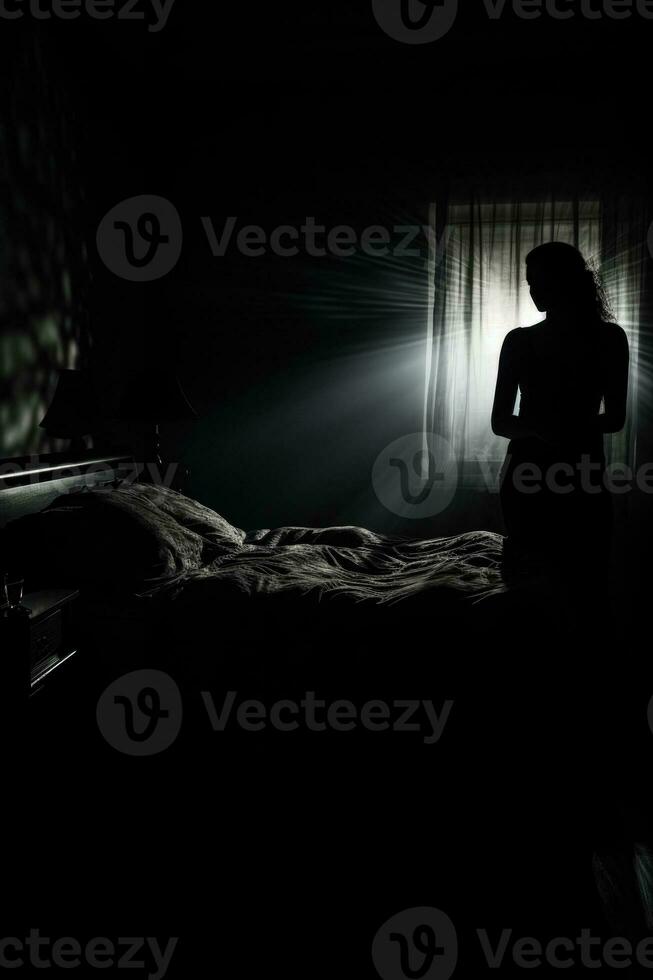 Shadowy figure looming over sleeping figure background with empty space for text photo