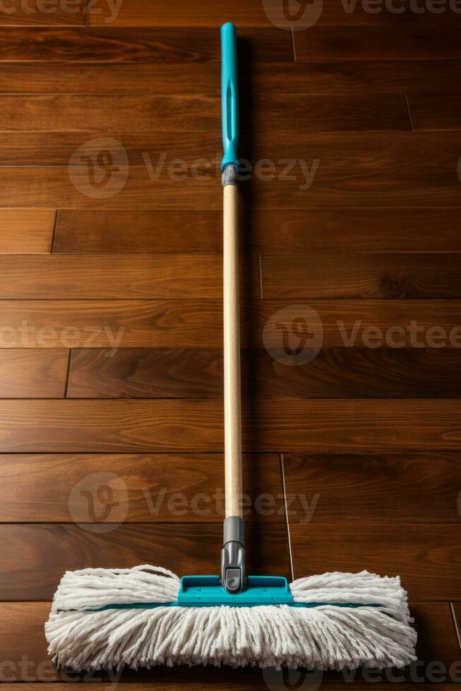 Hardwood floor mop with washable pad isolated on a brown gradient background photo